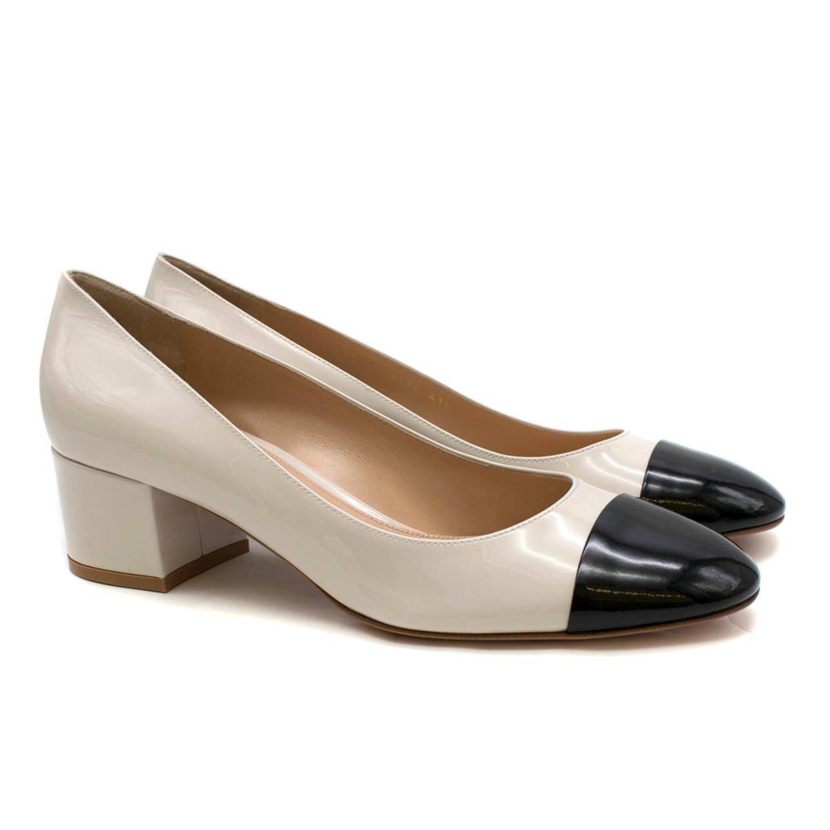 Gianvito Rossi Two-Tone Block Heel Pumps

- Vernice pumps 
- block heel 
- round toe
- slip on 
- contrasting black toe
- leather insole and sole

This item comes with the original box.

Please note, these items are pre-owned and may show some signs