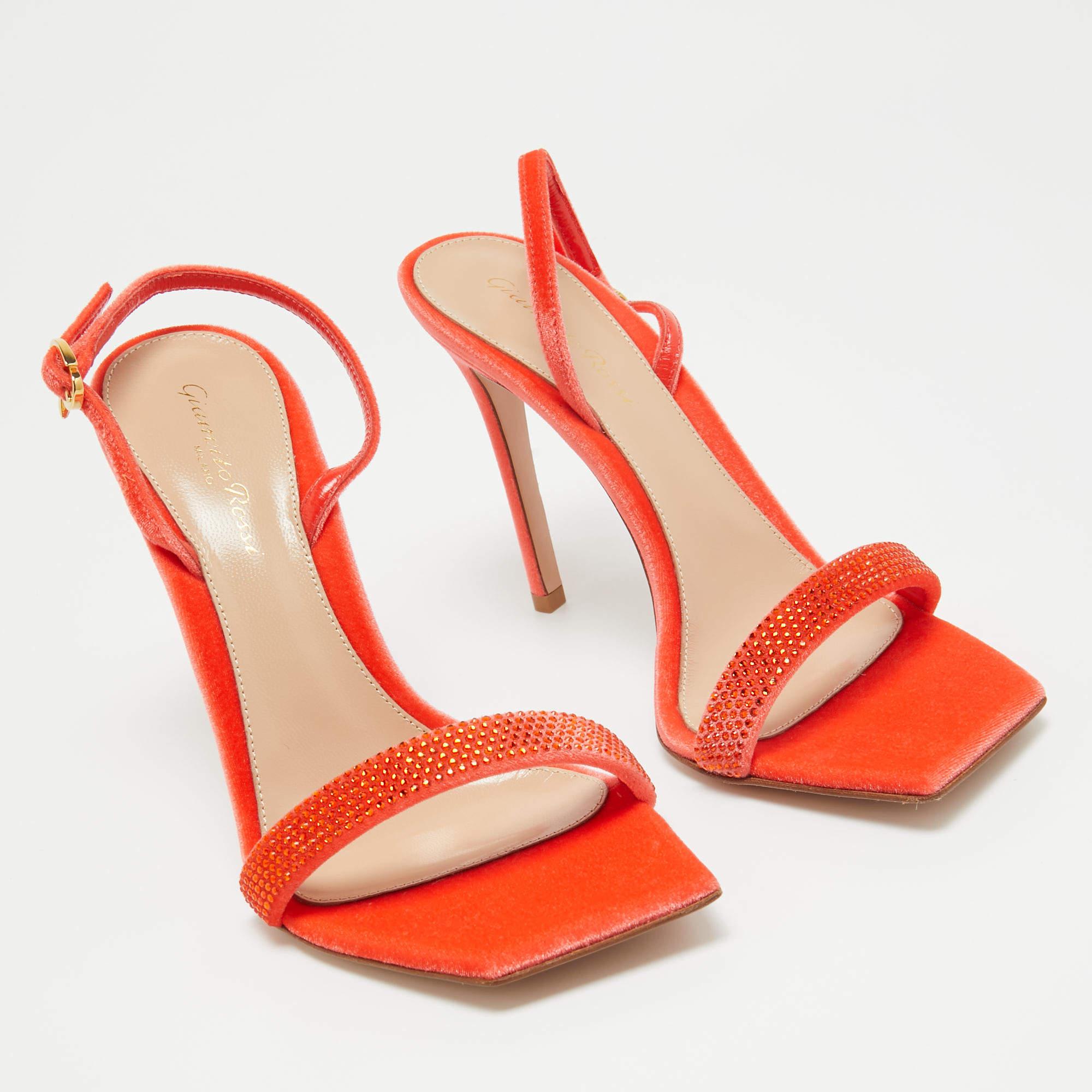 In vibrant orange leather, the Gianvito Rossi Minas sandals exude confident charm. Delicate straps gracefully embrace the foot, while a sturdy heel provides stability and style. With impeccable craftsmanship and timeless design, these sandals