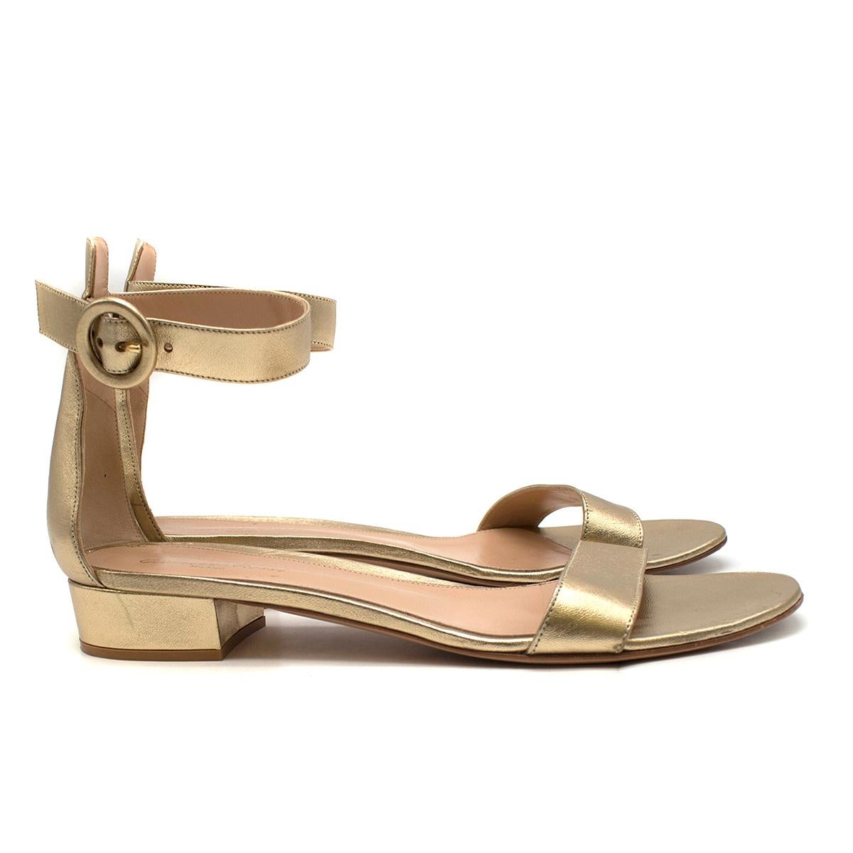 Gianvito Rossi Versilia 20mm gold leather sandals 

- Gold, lightly grained leather 
- Open toe, small leather-covered block heel 
- Slim front strap, adjustable buckle fastening ankle strap 
- Nude leather insole and sole 

Please note, these items