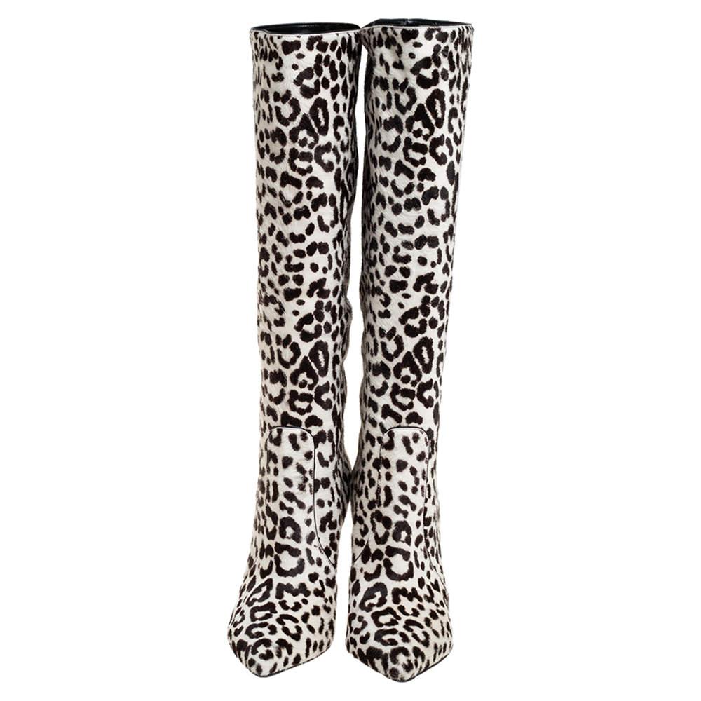 Simple and sophisticated, these knee-length boots from Gianvito Rossi are a must-buy for the fashionable you. These boots are crafted in animal-printed calf hair and come balanced on 8 cm heels. They can be paired with a long tunic or an oversized