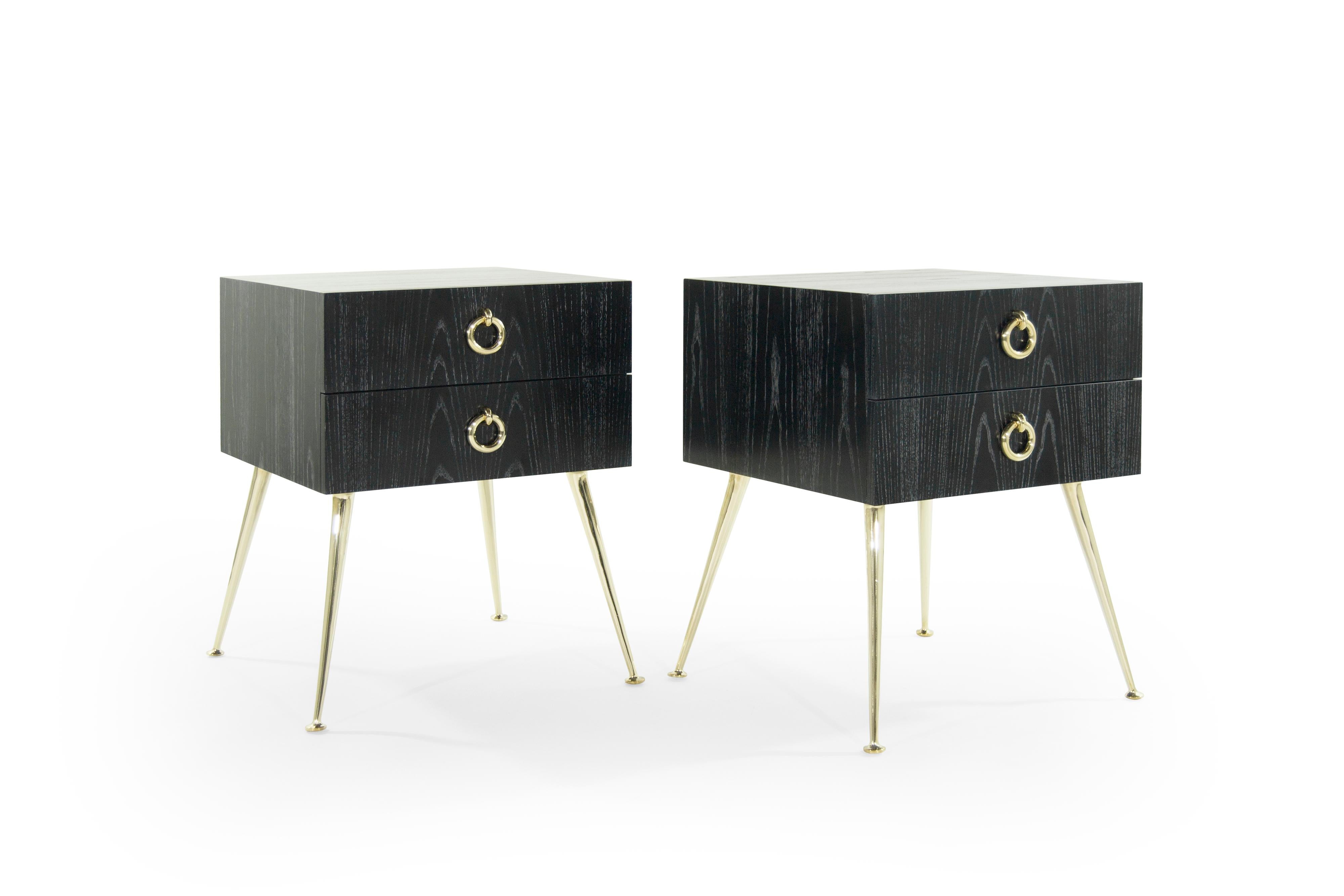 These mid-century modern tables are inspired by T.H. Robsjohn-Gibbings, whose design style captured fluid, water-like movement in furniture. Every leg is hand-cast in brass, tapering at an angle to finish in a subtle, melted pool. Large, matching