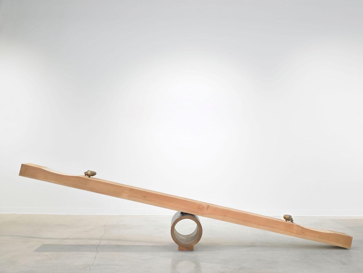 Giddy-up see saw by Vivian Carbonell of Carbonell design, a sculpture-trained furniture designer, handcrafted a functioning seesaw, the highlight of ten pieces on view. A chunky slab of Douglas fir timber balances on a dark blue metal pivot and is