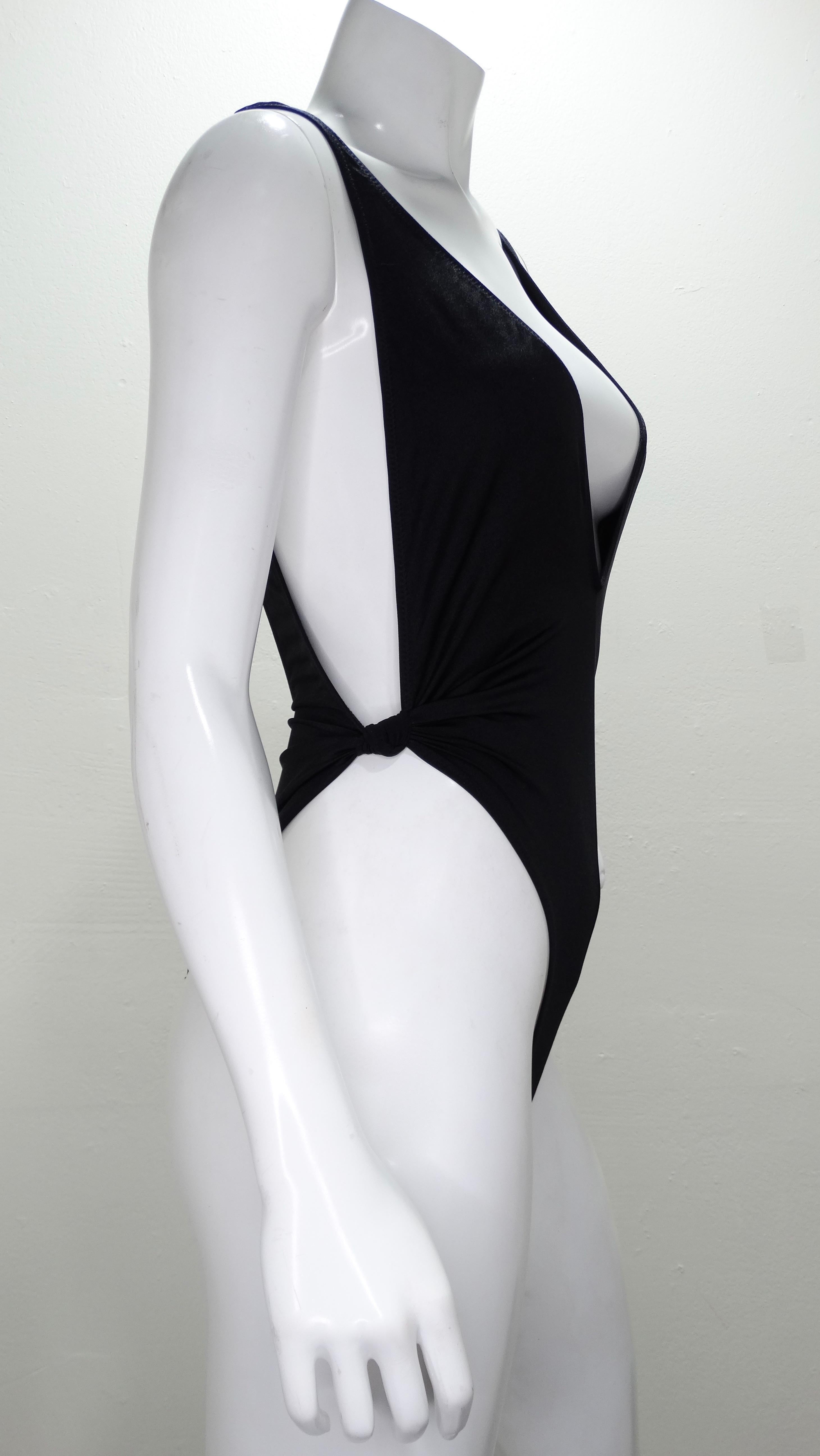 Be beach ready at all times with this Gideon Oberson one piece swimsuit! Circa 1990s, this sexy one piece features a ruched knotted waist with a deep v cut in the front and back. Perfect for the pool or the beach, this swimsuit will pair perfectly