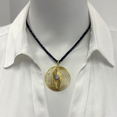"Gidi Swirl" Pendant with D-VS2 0.66 Carat Diamond in 18K Gold on Sapphire Chain