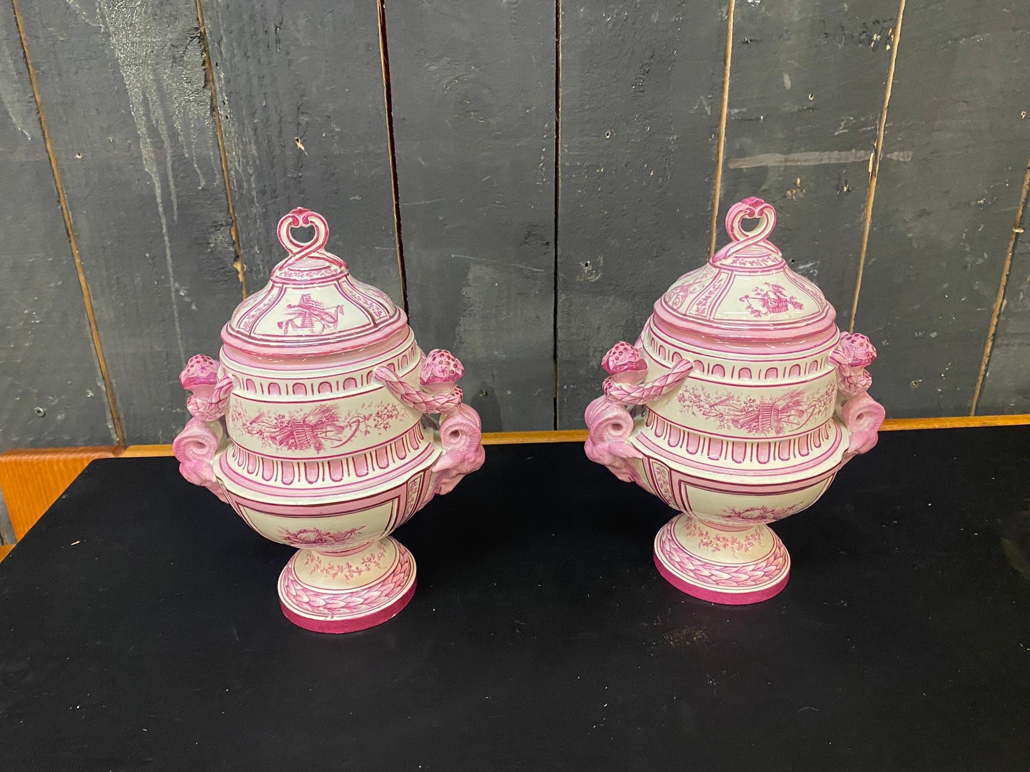 Gien. Pair of covered jars decorated in pink on a cream background called 