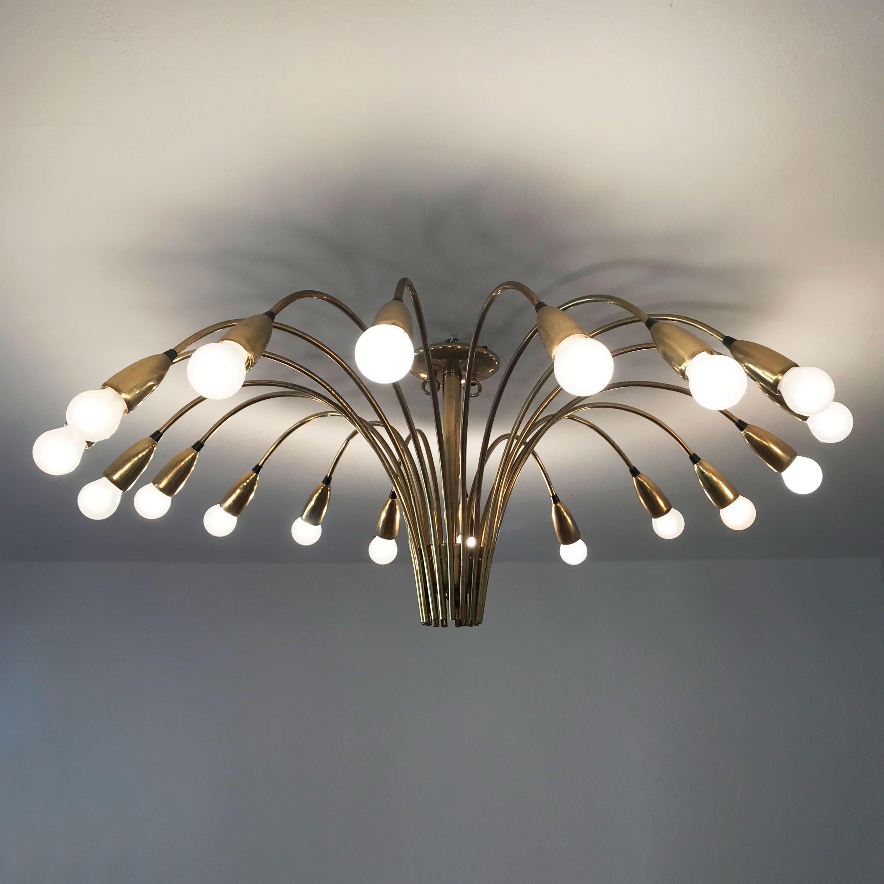 Stunning, gigantic Mid-Century Modern 18-armed Sputnik chandelier or ceiling lamp Spider with a diameter of ca. 47.25'' / 120 cm including bulbs.
Manufactured by Kaiser Leuchten, Germany, 1950s. Executed in brass tubes and sheet.

The chandelier