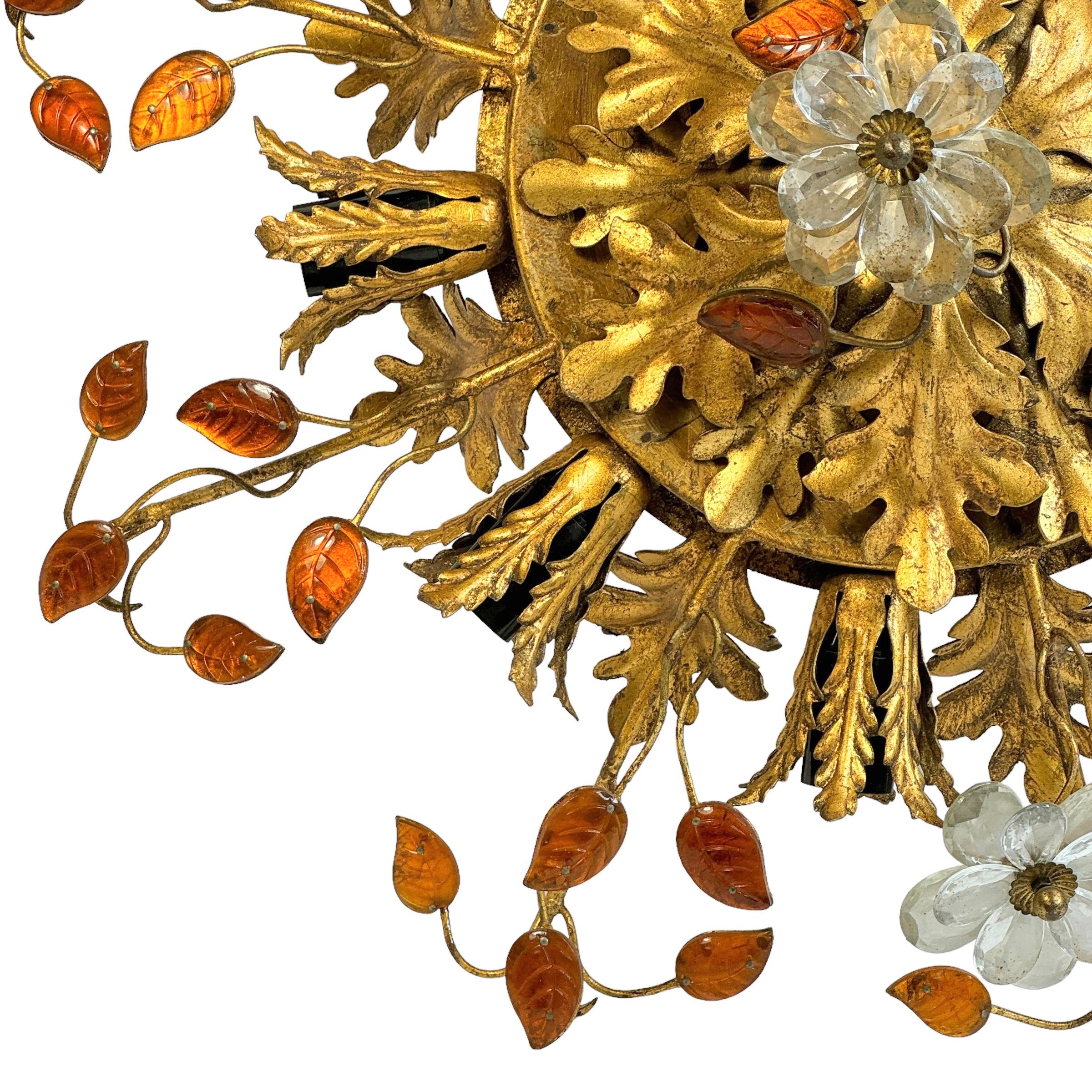 Add a touch of opulence to your home with this charming flush mount light. Perfect stunning gilt acanthus leaf design with clear Murano glass flowers and green Murano glass leaves on fine gilt stems, to enhance any chic or eclectic home. We'd love