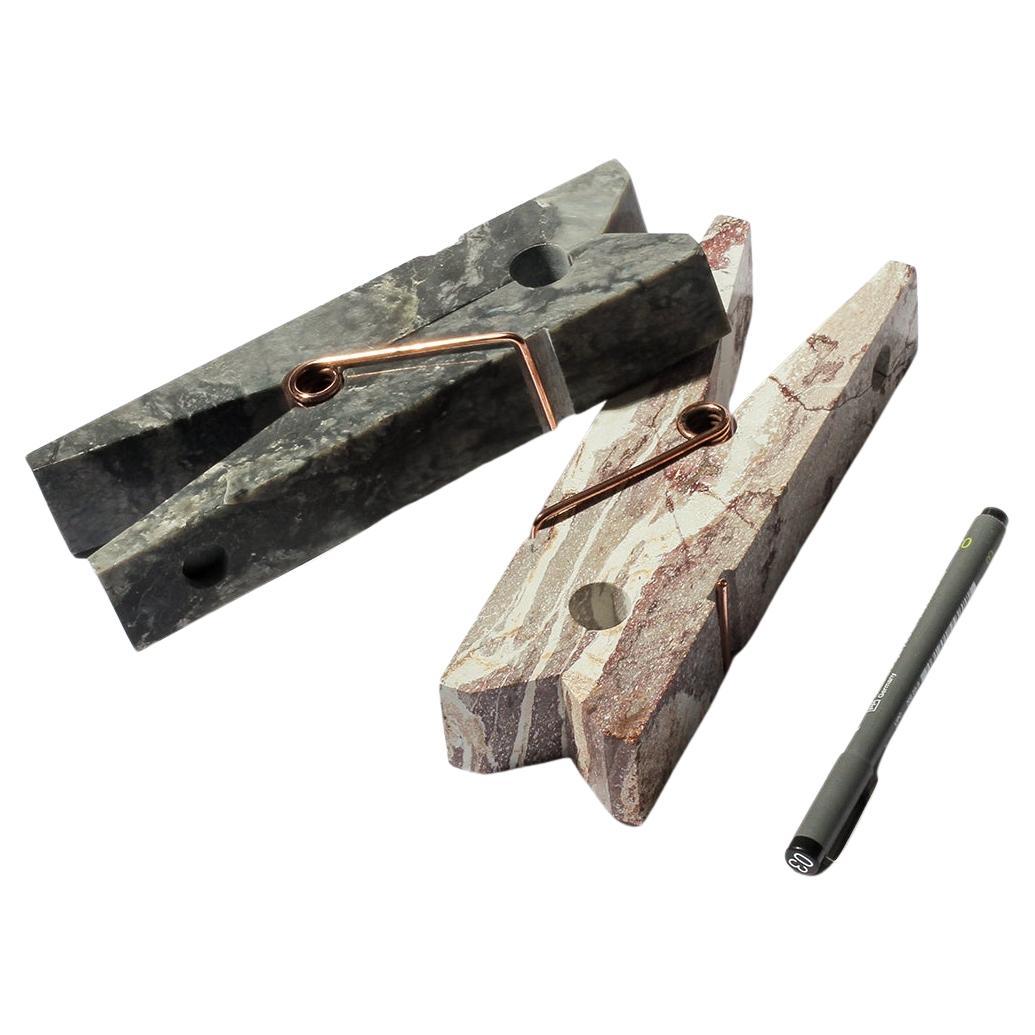 Extra large clip in natural stone, hand-carved. Each piece is a unique work of art.

This gigantic clip is a giganticly playful twist on the classic Laundry peg. Whether as a stylish paperweight, displaying your most luxurious laundry, or mounted on