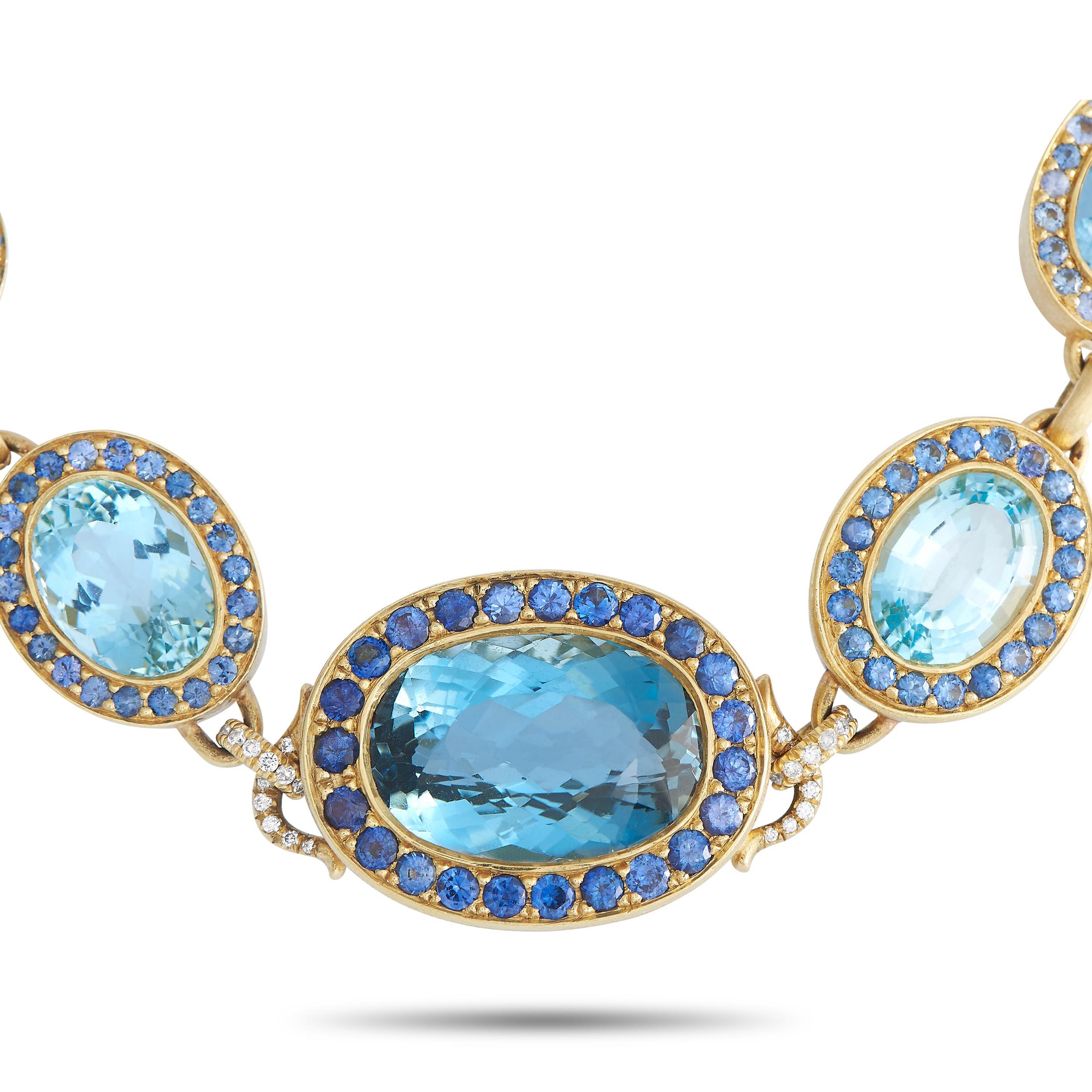 Here is a gorgeous multi-gem necklace exuding full retro glamour. This vintage piece is exquisitely fashioned in 18K yellow gold. It offers golden oval frames connected by diamond-encrusted links. Each frame is set with a faceted aquamarine