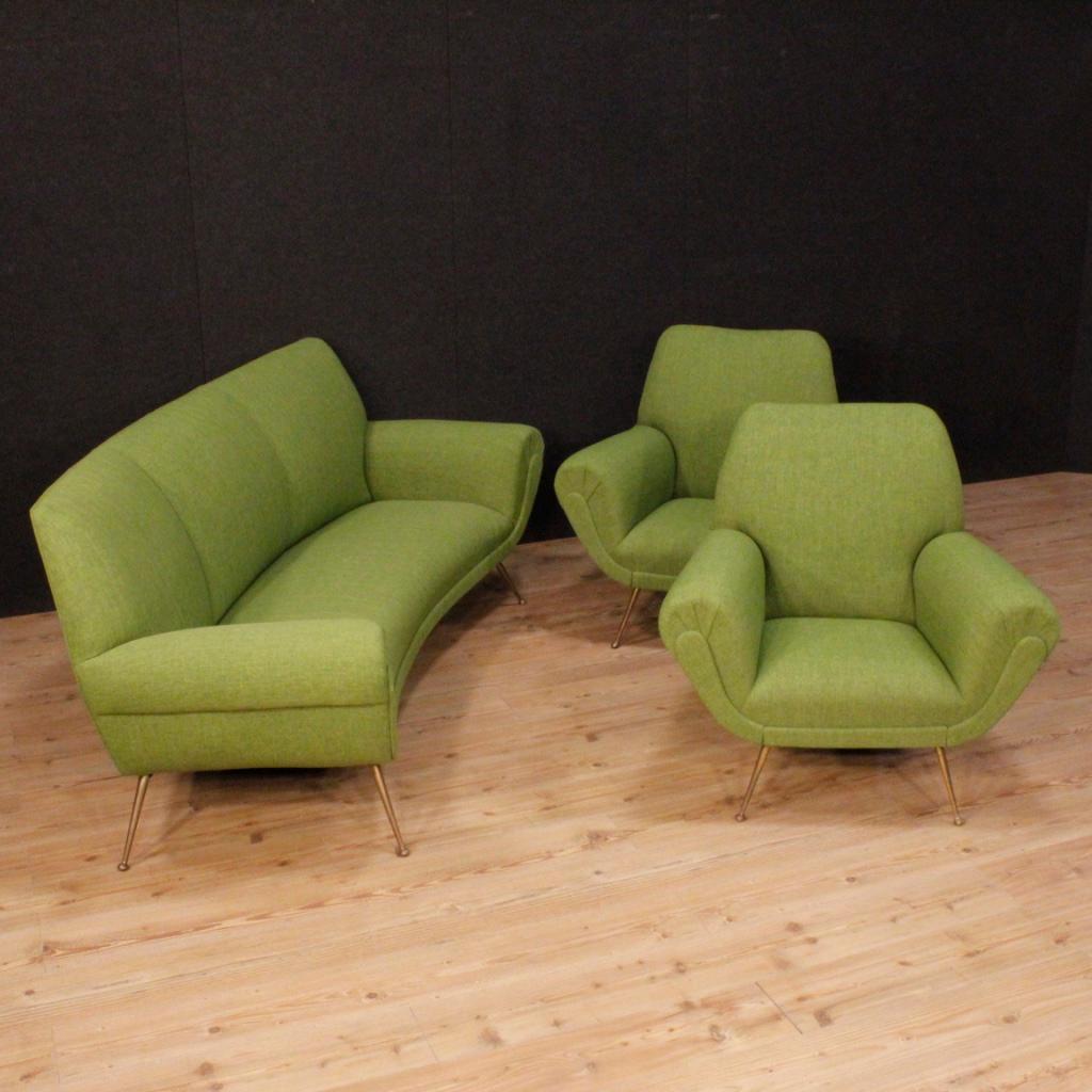 Set composed of two armchairs and a sofa of Italian design from the 1960s. Furniture by Gigi Radice for Minotti of fabulous line and pleasant decor upholstered in green fabric just replaced. Armchairs supported by metal legs with round feet of good
