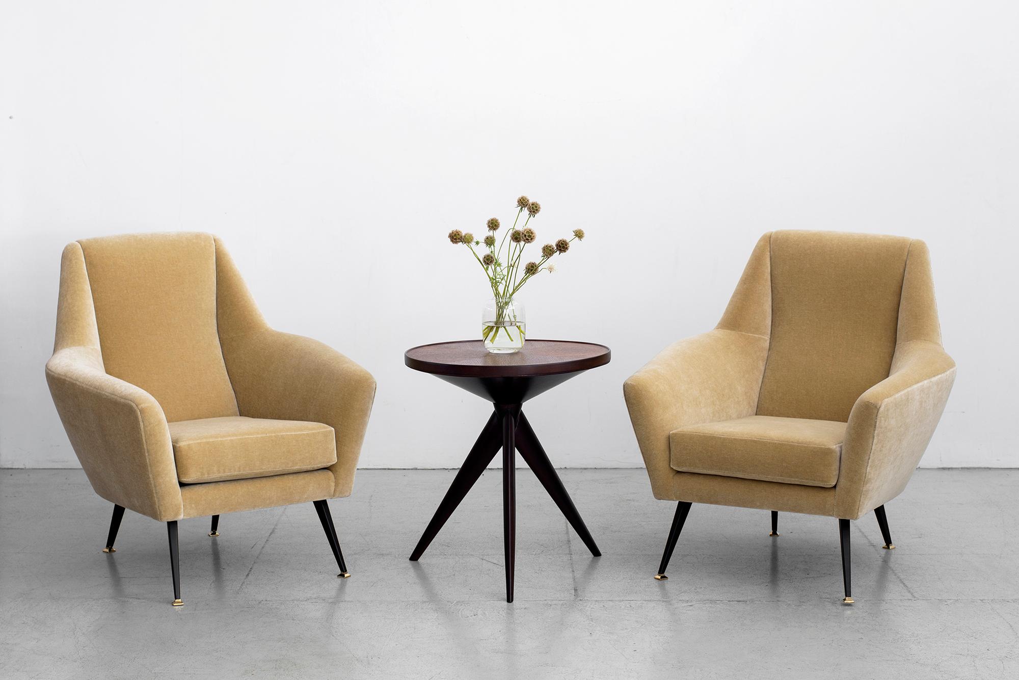 Great pair of large scale Italian club chairs attributed to Gigi Radice for Minotti.
Angular shaped arms and geometric shaped tapered back with iron and polished brass legs.
Newly upholstered in a creamy natural colored mohair.

 