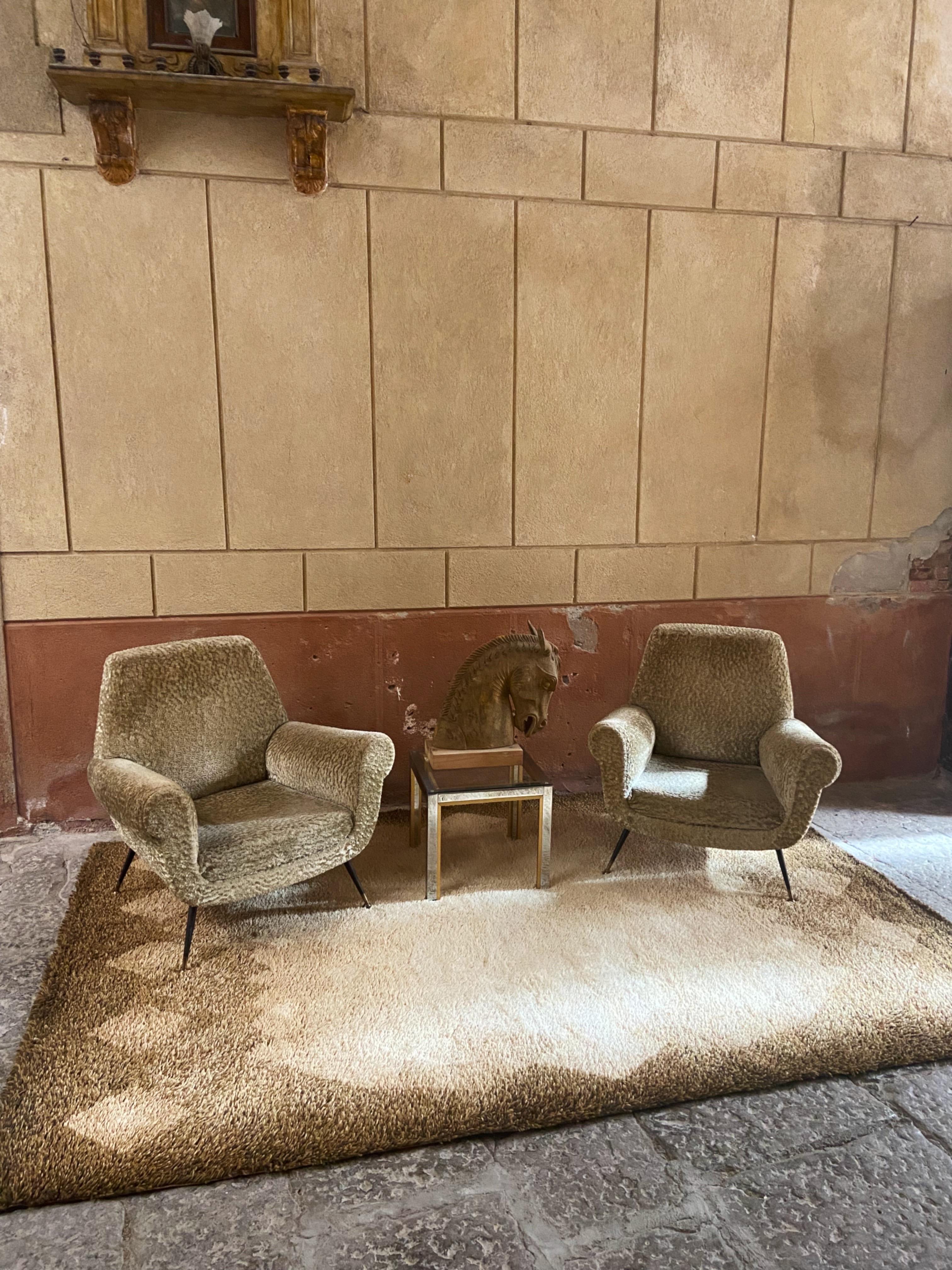 Elegant pair of club lounge chairs designed by Gigi Radice for Minotti. The chairs still have their original mohair velvet fabric from the 1950’s in a creme / beige color. Fabric shows some signs of use, see detailed pictures. 
Designer: Gigi