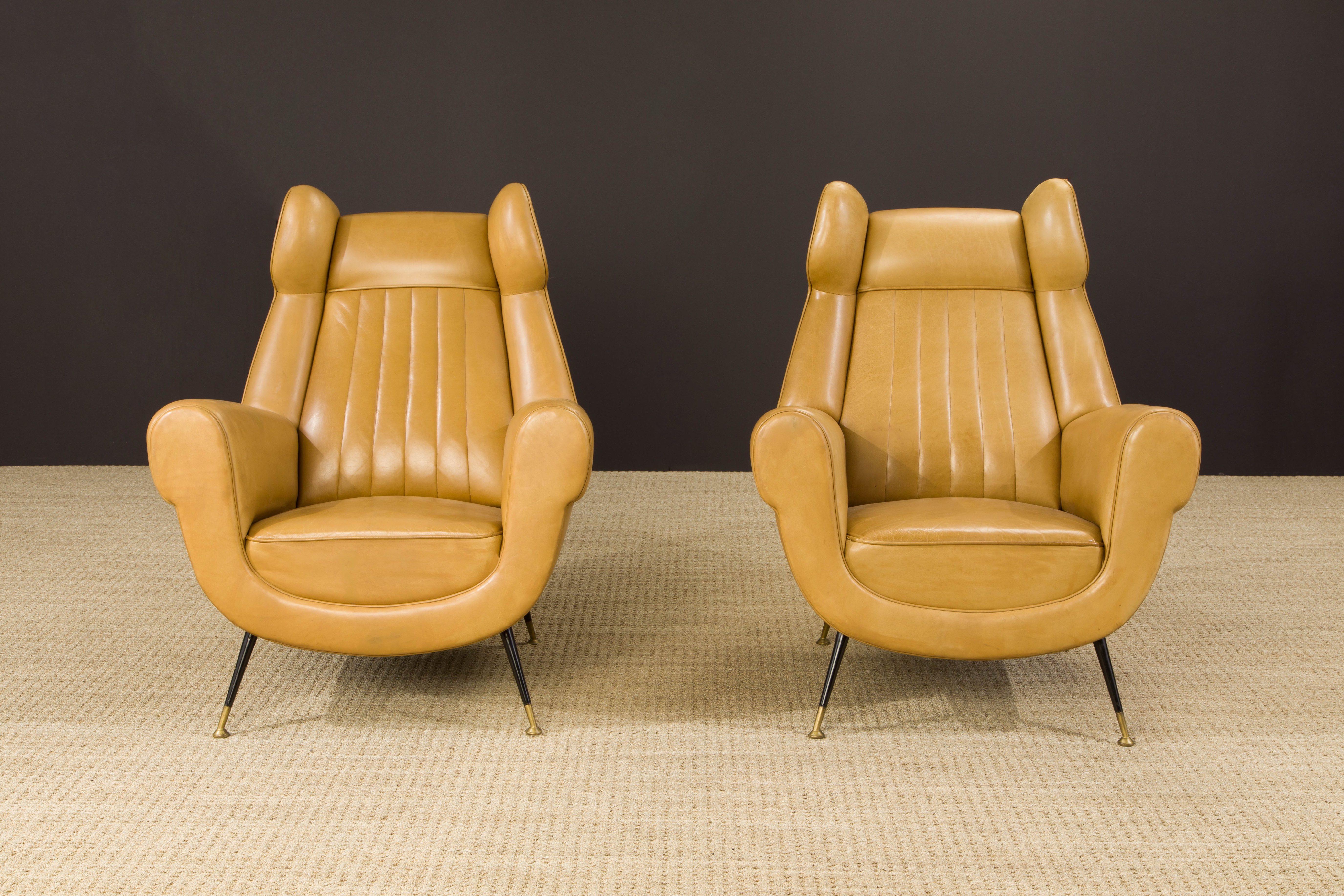 *Consolidated listing for client, pair of Gigi Radice lounge chairs and Tommi Parzinger dining table, detailed below:

This pair of 1960s Gigi Radice for Minotti leather wingback chairs are currently the gallery owner's favorite pair of armchairs in