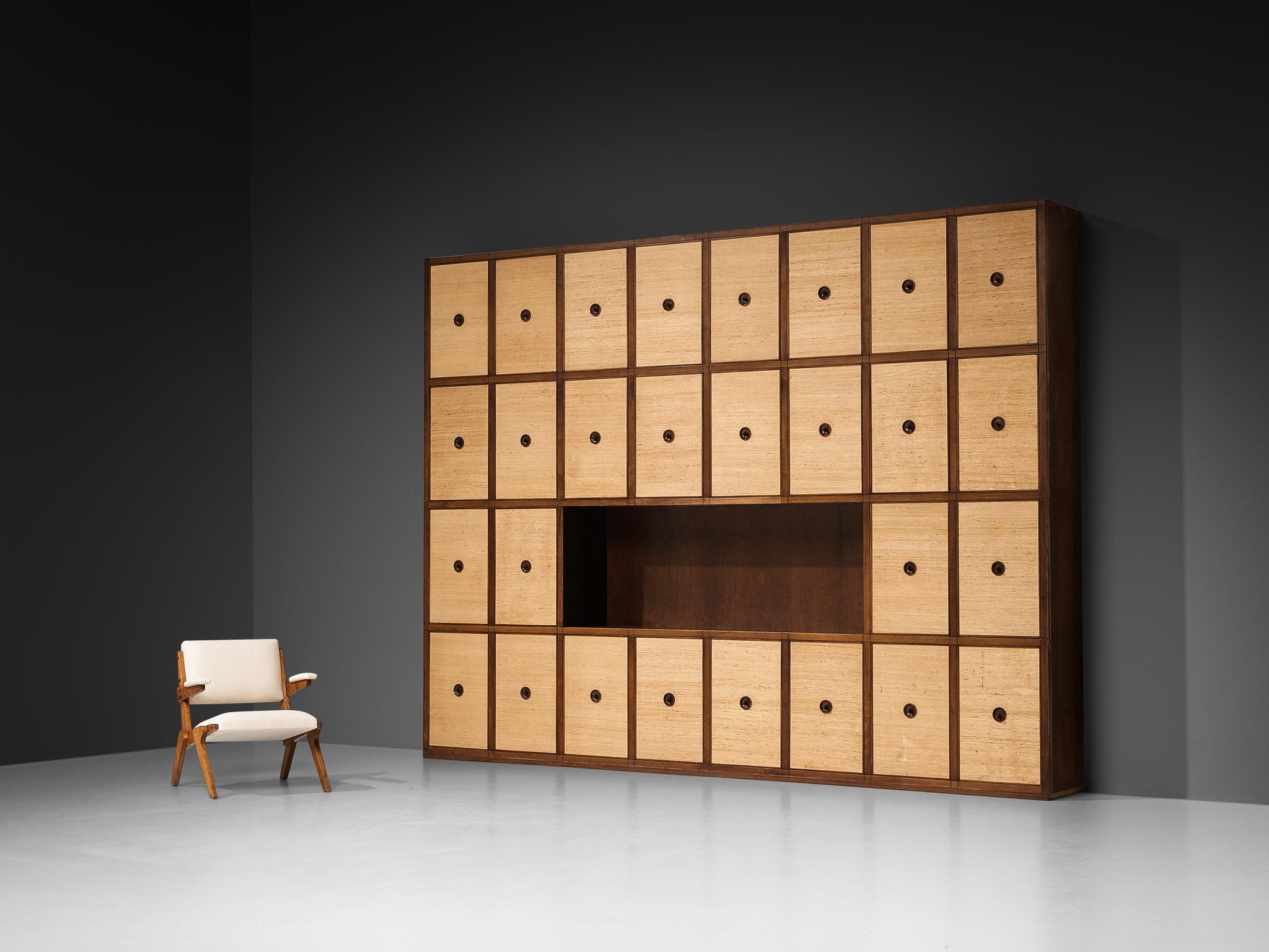 Gigi Radice for Studio Gino Colombo, custom made wall unit, walnut, seagrass, Italy, 1950s. 

This custom-made wall unit by Gigi Radice for Studio Gino Colombo, crafted in 1950s Italy, is a clear reflection of mid-century modern ideals, but it