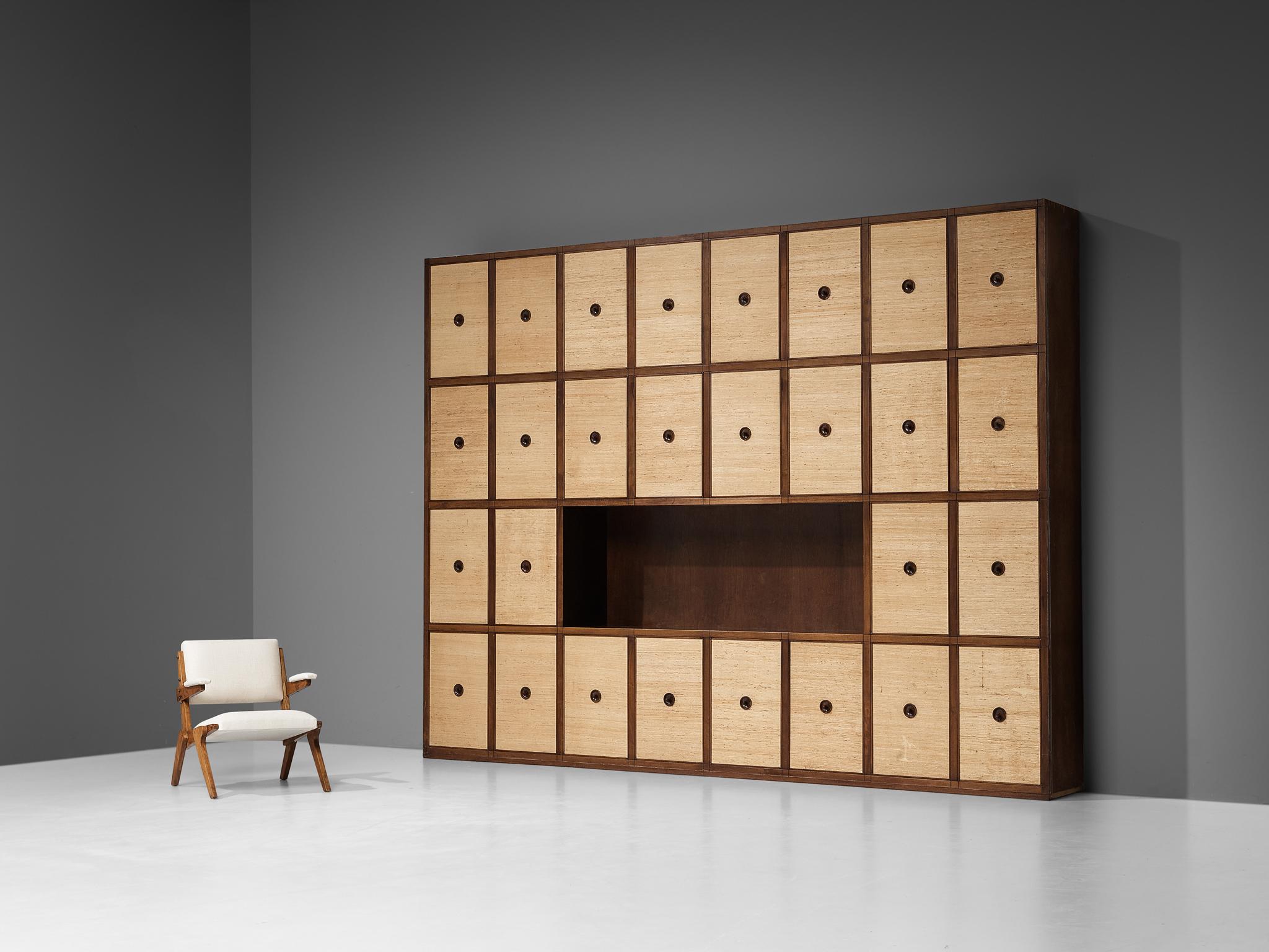 Gigi Radice for Studio Gino Colombo, custom made wall unit, walnut, seagrass, Italy, 1950s. 

Impressive custom-made large cabinet designed by Italian designer Gigi Radice in the 1950s. Equipped with 28 doors, this sizeable cabinet offers plenty of