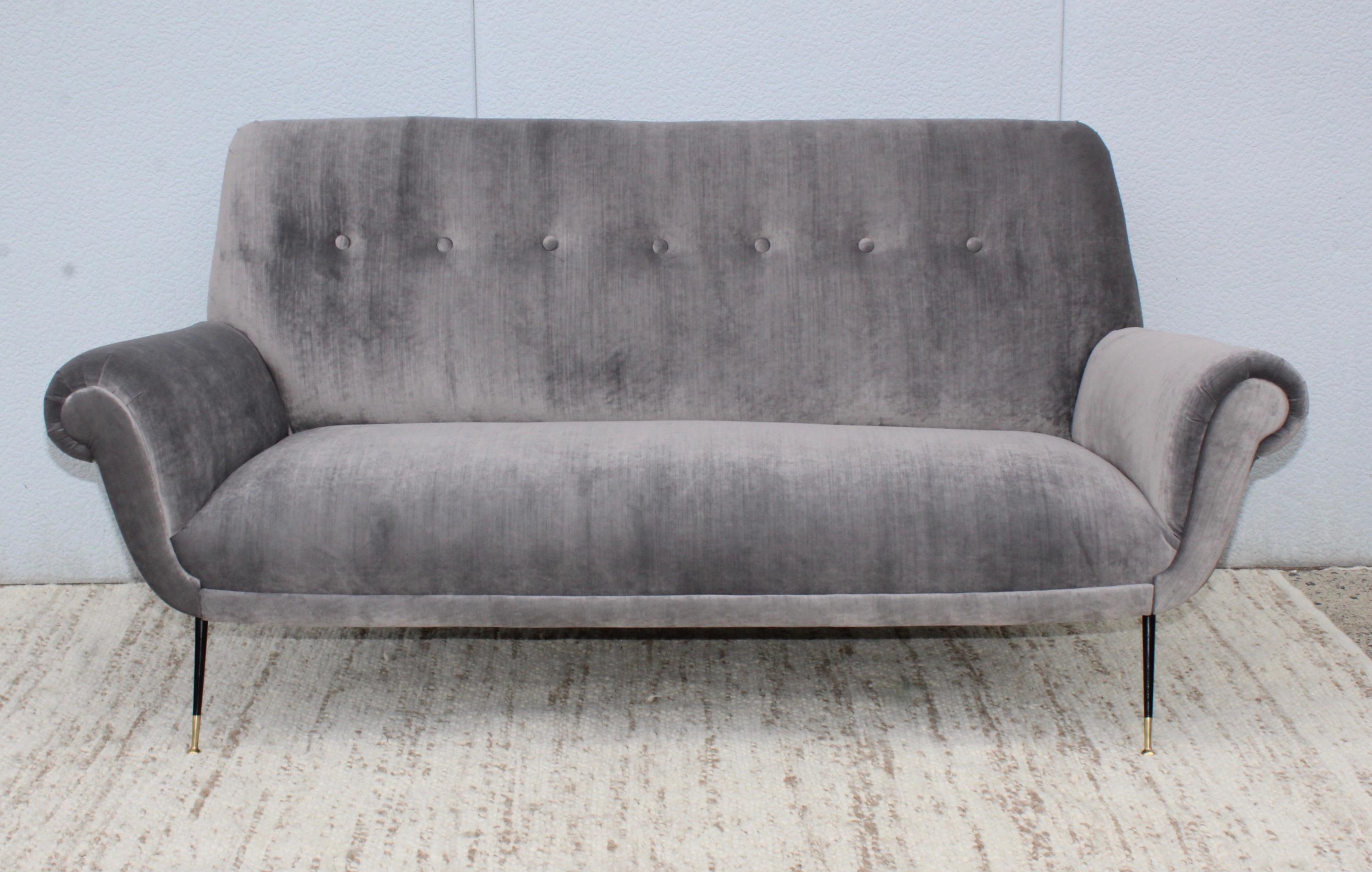 1950s Gigi Radice sofa fully restored and reupholstered in gray velvet.