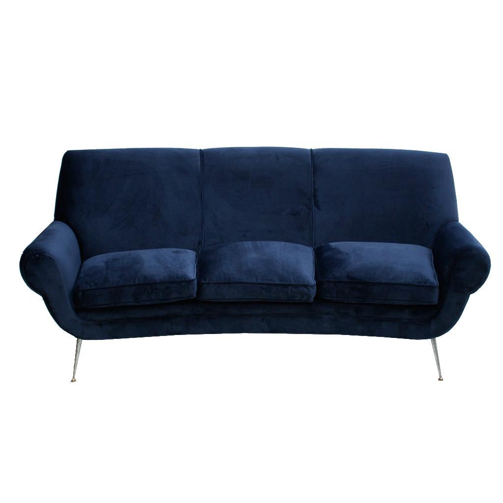 A stunning curved three-seat sofa designed byItalian designer Gigi Radice and edited by Minotti. Structure made of solid wood with metal legs. Newly reupholstered in midnight blue cotton velvet. Italy, 1950s.

Our main target is customer