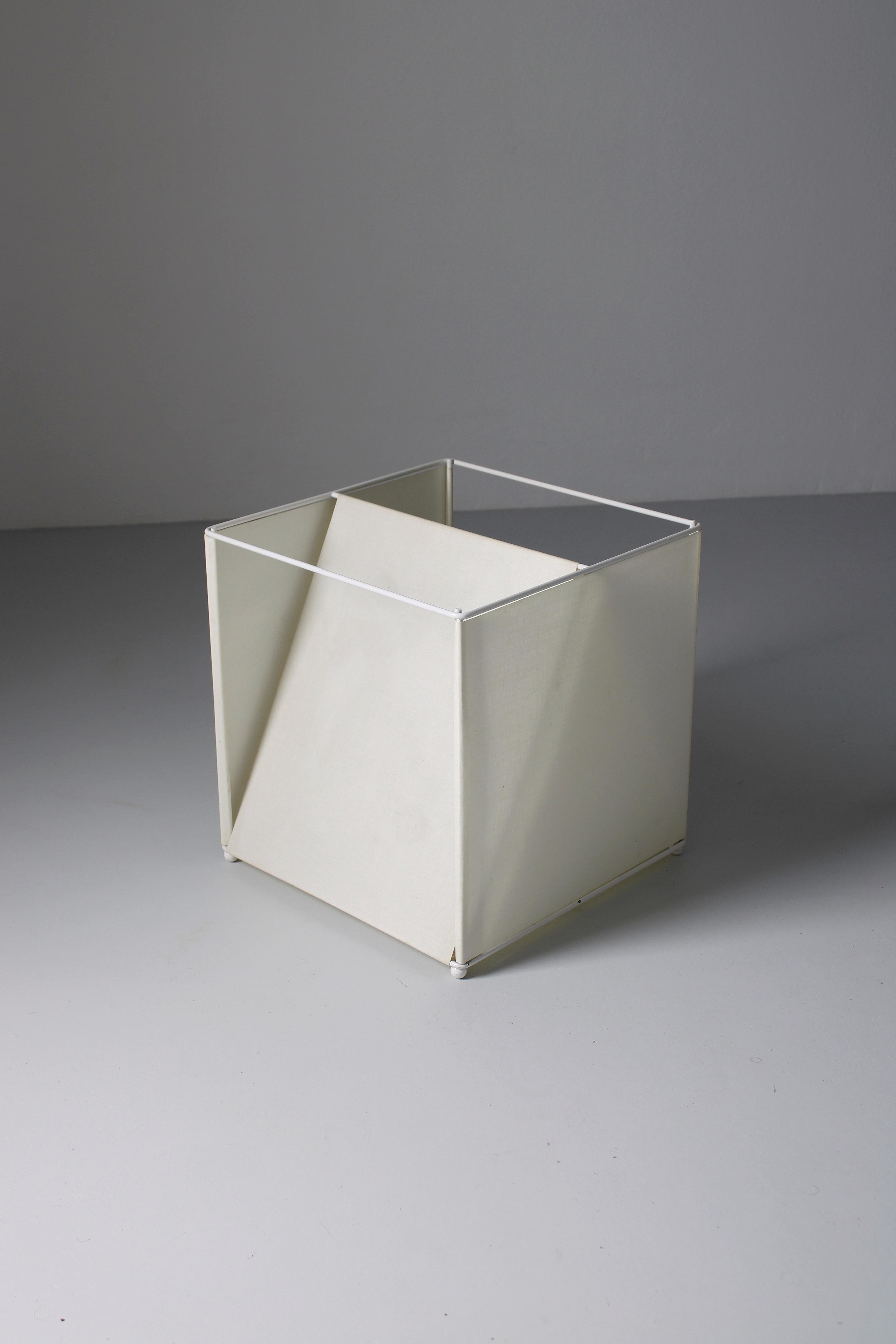 Table or wall lamp, model Gigia. Made by the industrial designer Piero de Longi. This lamp consists of a metal structure in combination with a crème colored fabric. It was produced by a small lighting and furniture company named IBIS, which was