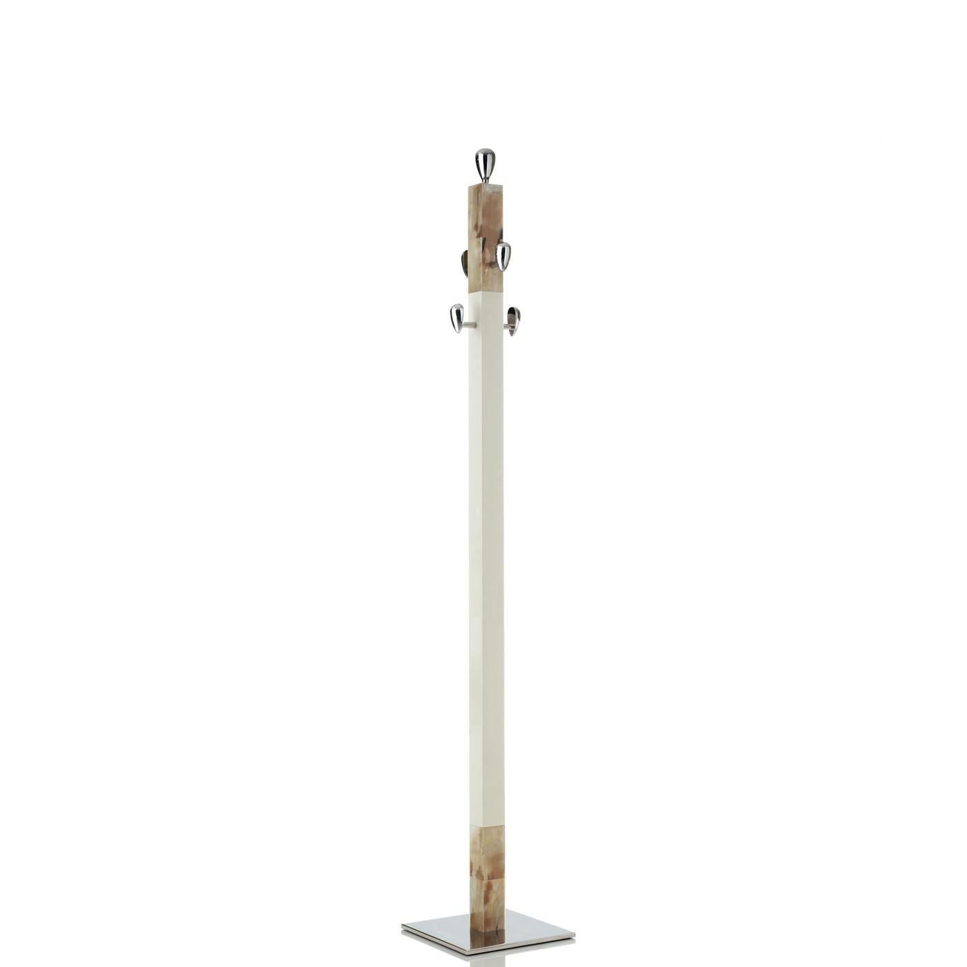 Giglio Coat Stand by Arcahorn
Dimensions: D 30 x W 30 x H 185 cm
Materials: Horn, brass.

Coat stand. Structure in wood with lacquered ivory gloss finish and horn inlays. Base and hooks in chromed brass.

Colors and shades of horn processed by