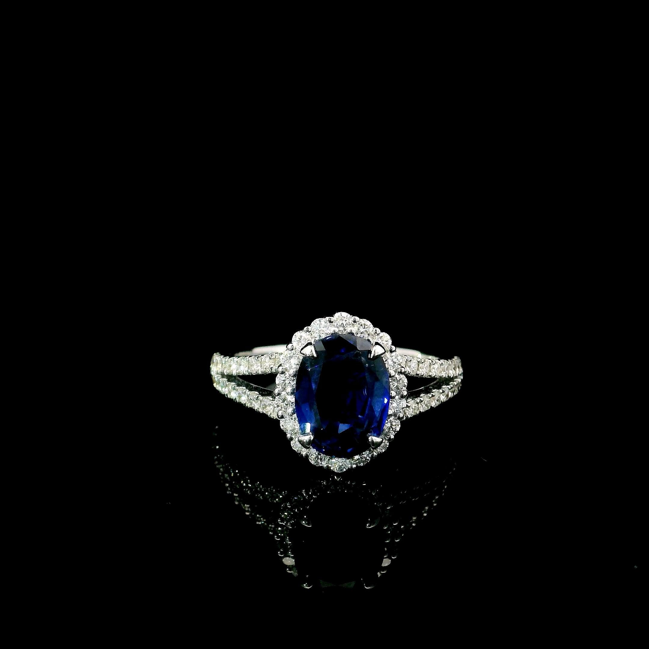 18kt white gold sapphire ring with diamonds
  
  Gold colour & karat: White gold 18kt
  Weight: 4.11 grams
  
  Set with-
  Stone type: Sapphire
  Shape: Oval
  Carat: 1.75
  Colour: Blue
  Clarity: -
  
  Surrounding Stones: Diamonds
 1) Side White