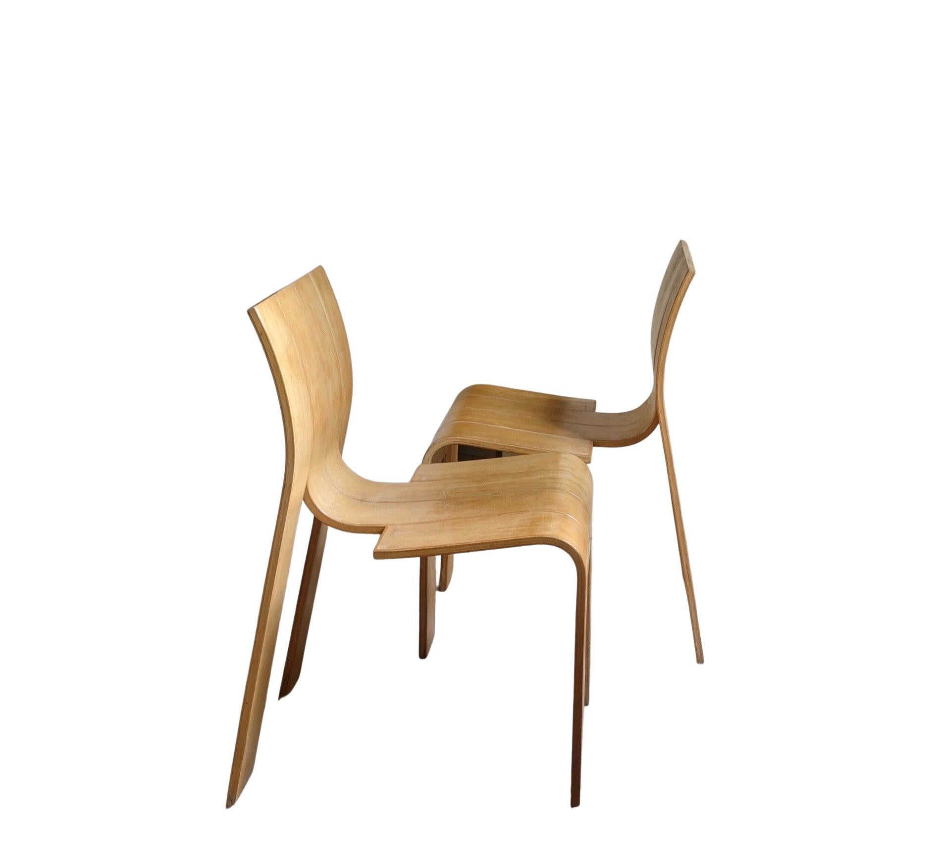 Gijs Bakker for Castelijn
Set of two Strip chairs 
Netherland, around 1970

Set of two ''Strip'' wood dining chairs, the Netherlands, 1974
The chairs are made of four strips of pressure moulded laminated beech wood linked by dowels.
The curved