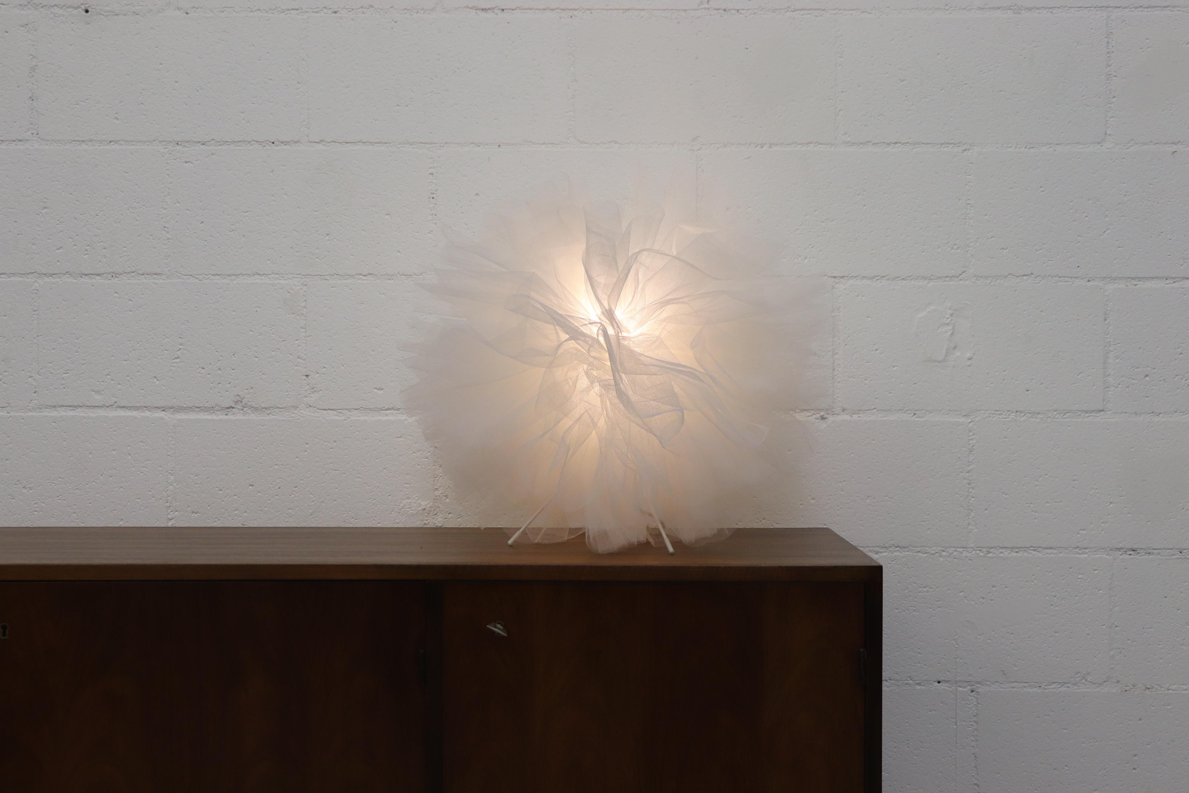 Beautiful table lamp by Gijs Bakker & Herman Hermsen. The 'ballroom lamp no. 2' designed in 1997, is a creative conversation piece designed to resemble a carnation. Made of fine white lace netting on a light wire metal frame it is in original