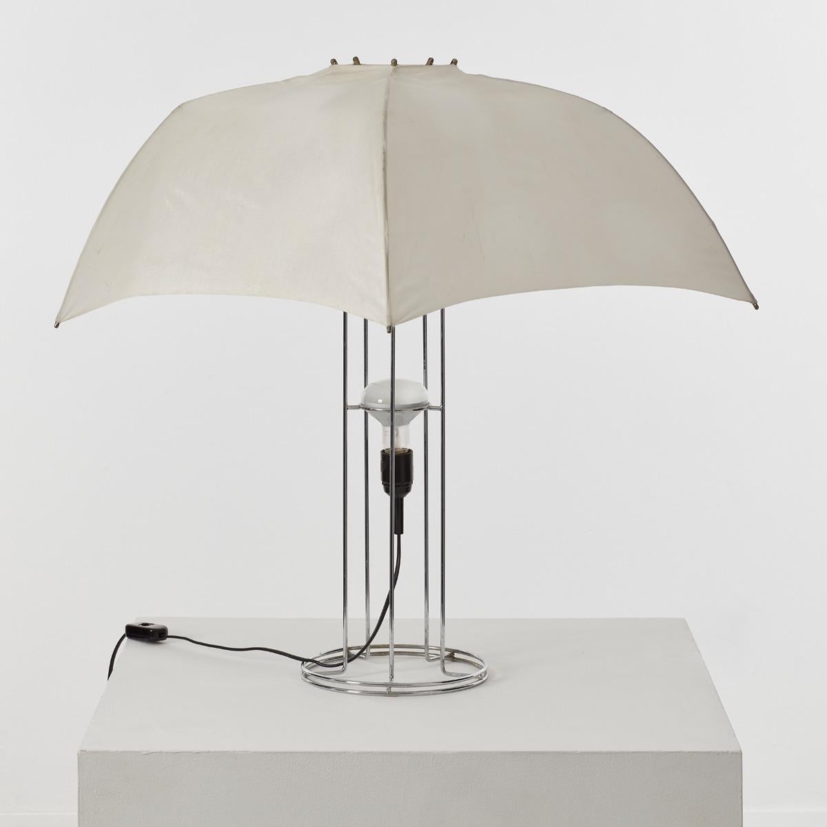 Designed by Gijs Bakker in 1973 and taking inspiration from the light defusing umbrellas used in photography studios. Bakker aimed to create a lamp with the function dispersing the light. The source of light is a simple lightbulb not masked by the