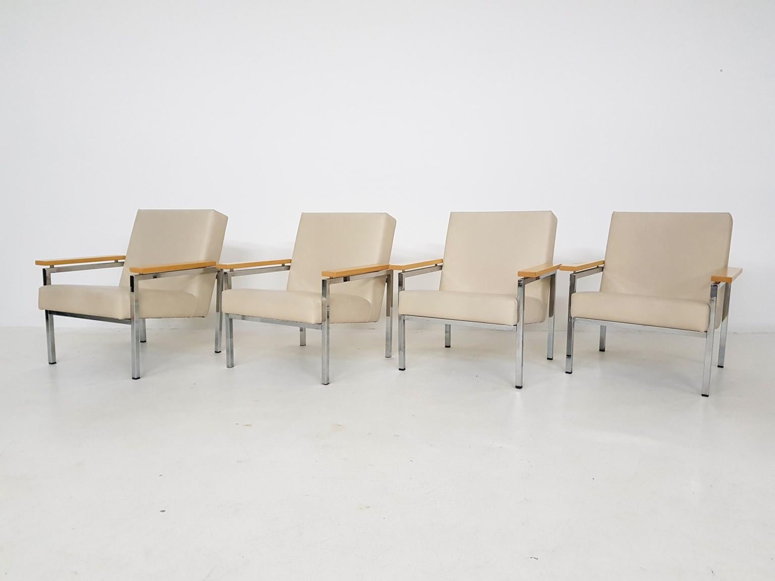 Dutch midcentury design lounge chairs by Gijs Van Der Sluis. Made and produced in the 1960s in the Netherlands.

The lounge or arm chairs have a chrome frame with wooden arm rests and beige leather upholstery. In good condition.

Price is per
