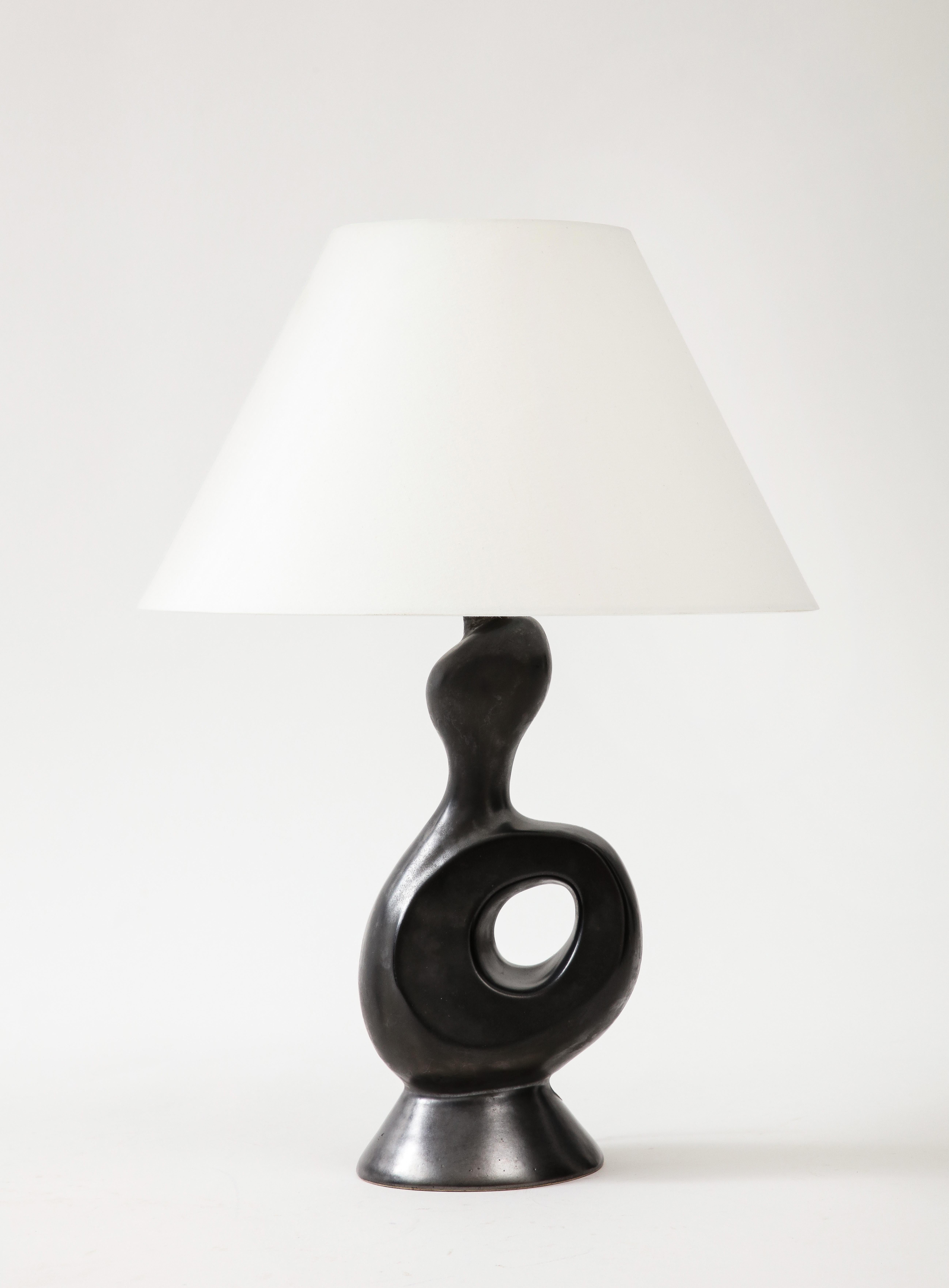 Gil Angoloni, ‘Bird' Black Glazed Ceramic Lamp w/ Parchment Shade. France, c. 1950, signed

Orleans Earthenware, France

Since listed:  This Lamp has been rewired to a dark brown silk twist cord with switch and a single Edison bronze socket.  A