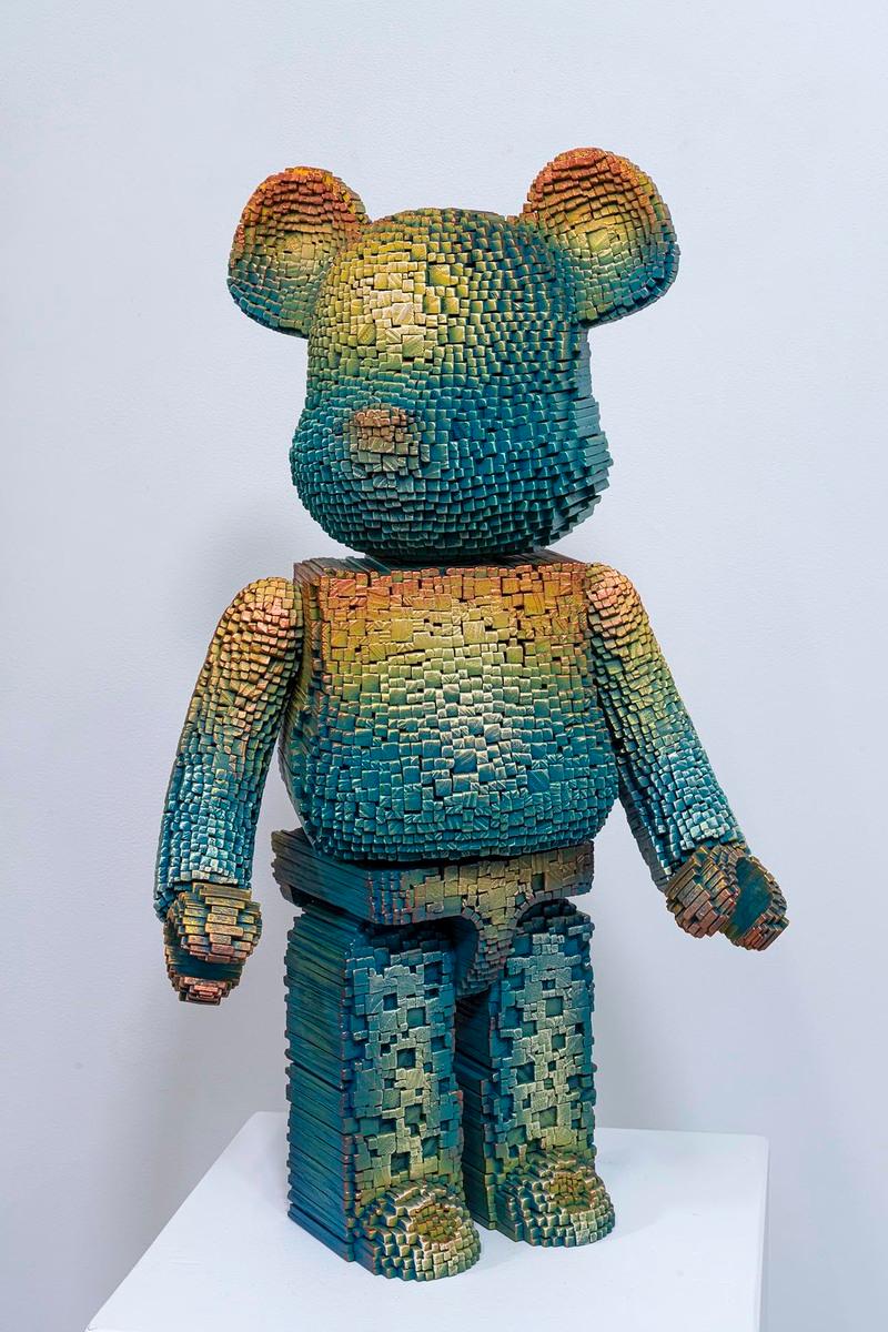 Original and unique sculpture, stacked wooden sticks and paint.

Signed and titled on the back of the sculpture.

This captivating work of art depicts a sculpture in the shape of a stylized bear, constructed from multiple stacked blocks in a