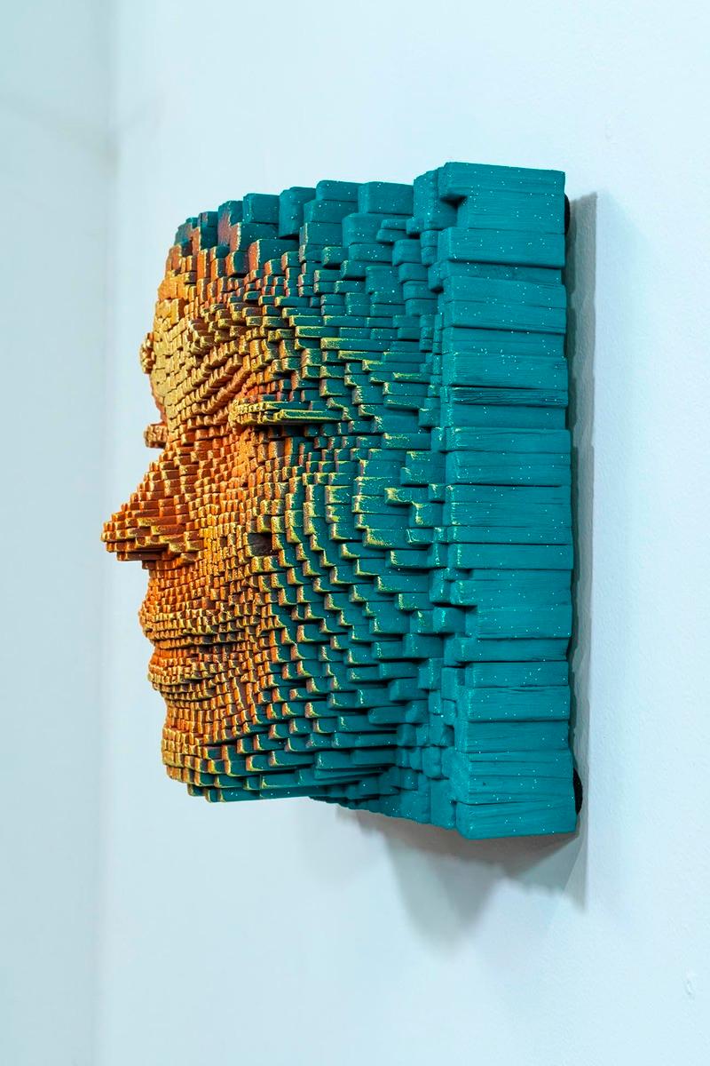Wall sculpture - stacked and painted wood sticks, acrylic paint.

Unique and original wall sculpture by Gil Bruvel. 
From the iconic Mask sculpture series.  
Gil Bruvel is a visual artist who was born in 1959 in Sydney, he lives and works in