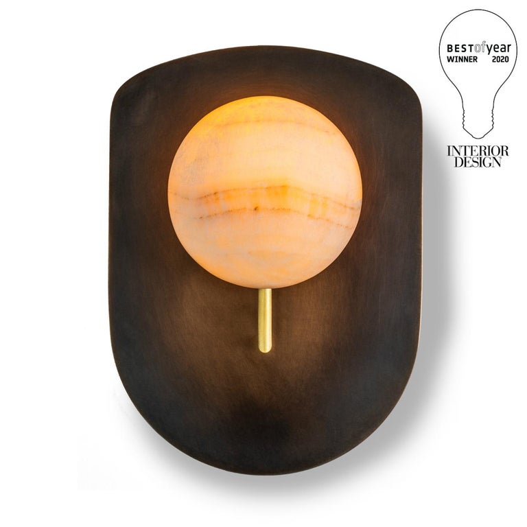 Winner of Interior Design Magazine's 2020 BEST OF YEAR award - the Gil Melott bespoke Luz SC form 19 bronze and alabaster sconce serves not just as a light fixture, but as an anthropomorphic piece of sculpture adorning the wall. Its delicate form