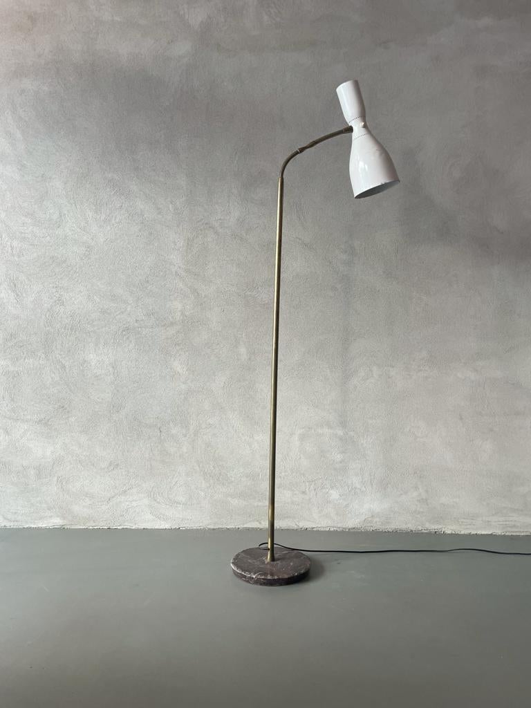 Floor lamp manufactured by Gilardi & Barzaghi in Italy, 1950s.
Floor lamp has circular base in dark marble that supports brass stem.
Final part of brass stem is not rigid and it can be move to adjust the height and position of the double