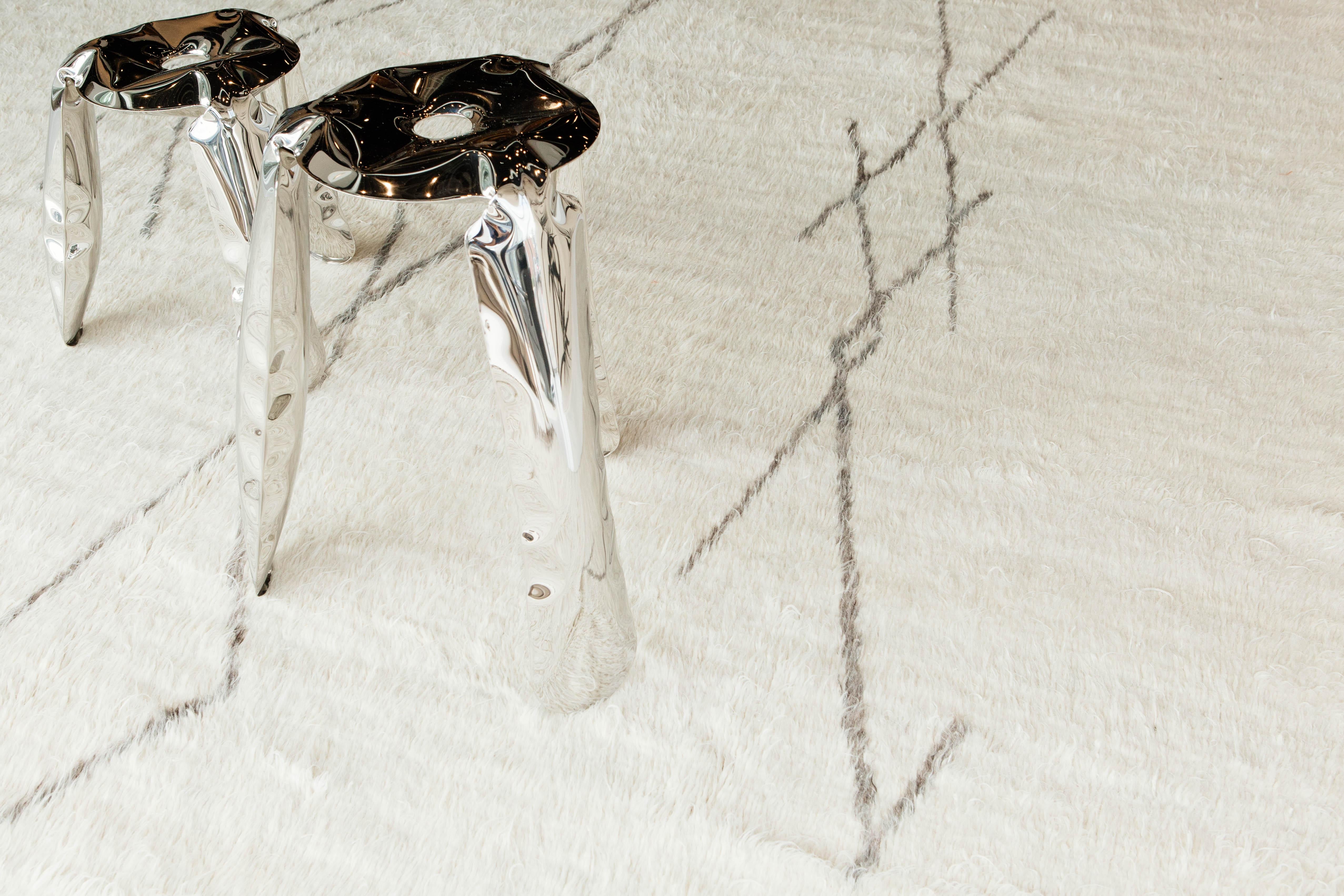 The signature Collection of California. Handwoven luxurious wool rug, made of neutral earth tone flat weave with the perfect white shag and taupe accent design motifs. Haute Bohemian Collection: designed in Los Angeles named for the winds knitting