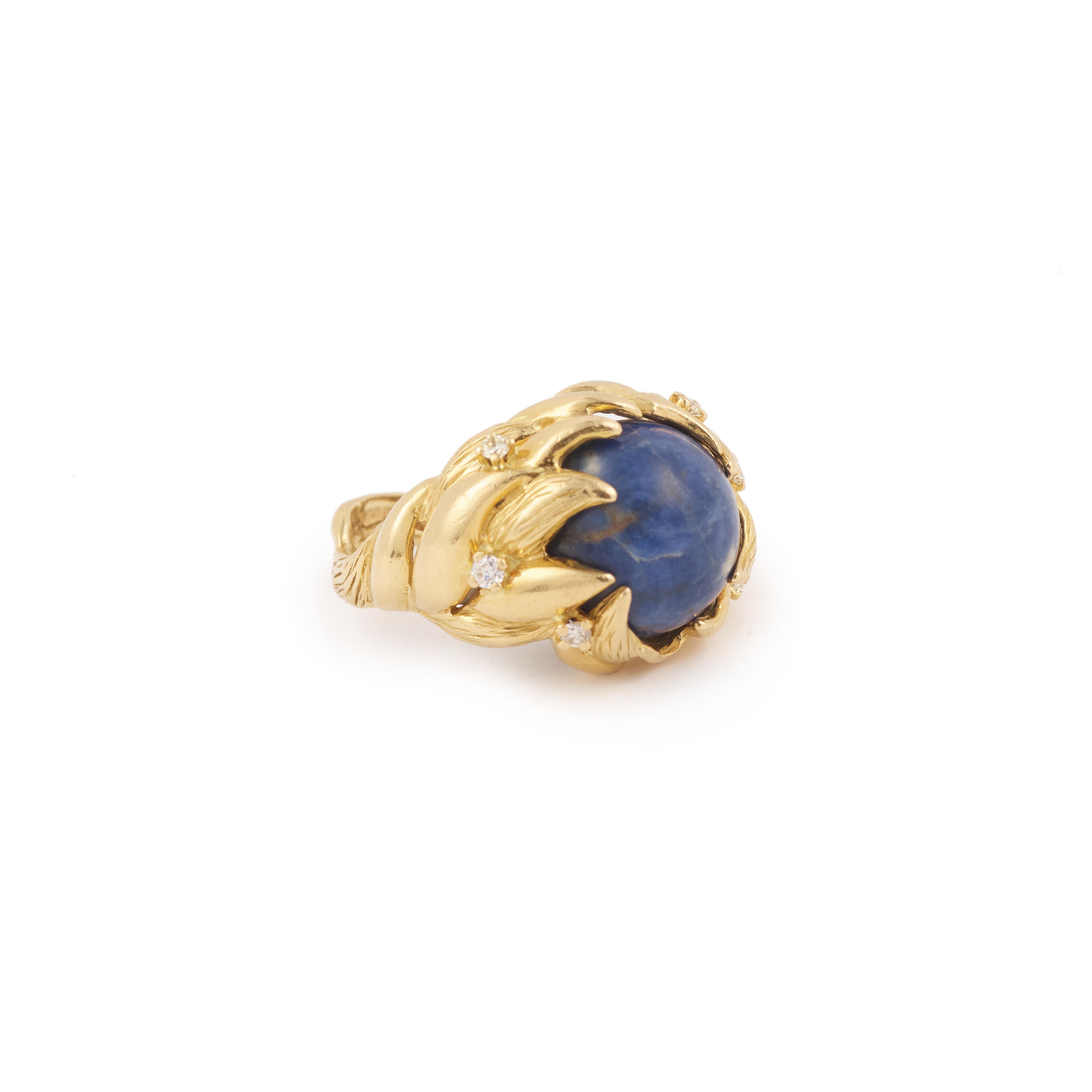 Famous ring signed Gilbert Albert in yellow gold enhanced with diamonds and adorned in the center of a ball of gemstone changeable according to your desires.

12 balls are provided : hematite, carnelian, tiger eye, snow obsidian, sodalite, ivory,