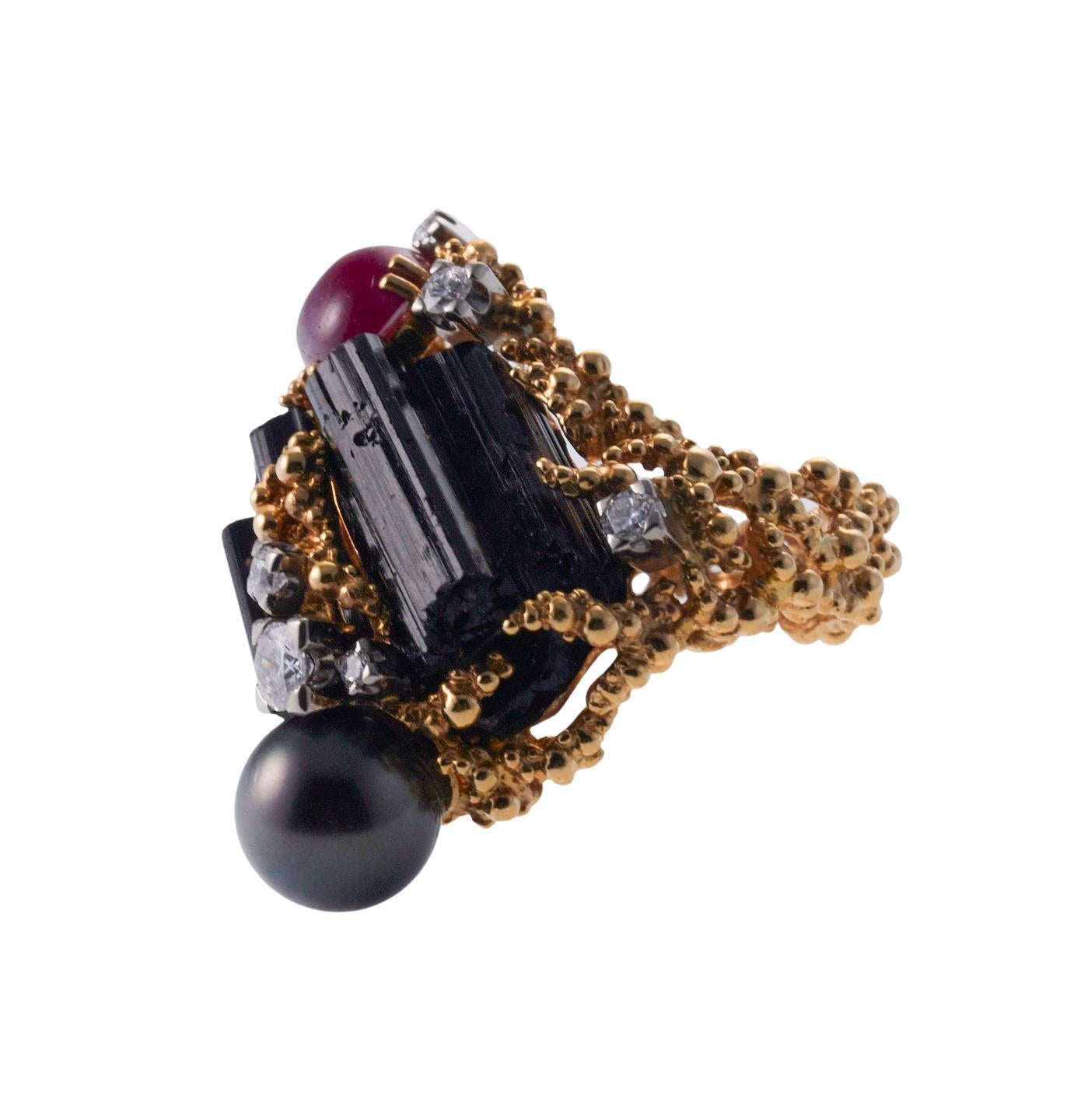 1970s 18k gold ring by Gilbert Albert, set with Tahitian pearl, cabochon ruby, tourmaline and approx. 0.58ctw in G/VS diamonds. Size 7.