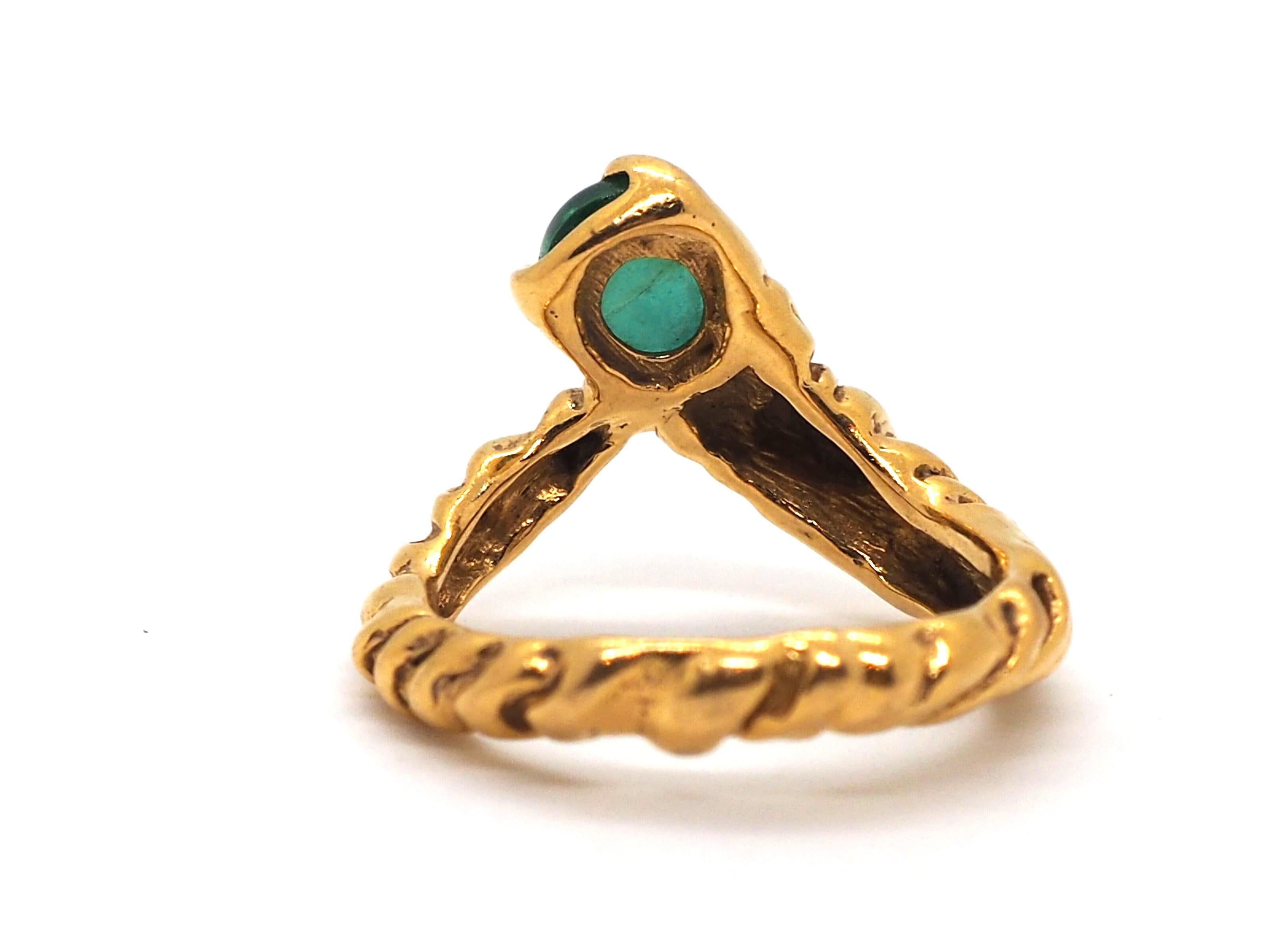 Beautiful ring by Gilbert Albert, with his characteristic style inspired in the nature, made of 18 karats yellow gold, decorated with one oval shape emerald of 7,64mm x 6.10mm. 

This ring will bring elegance and sophistication to any style. A real