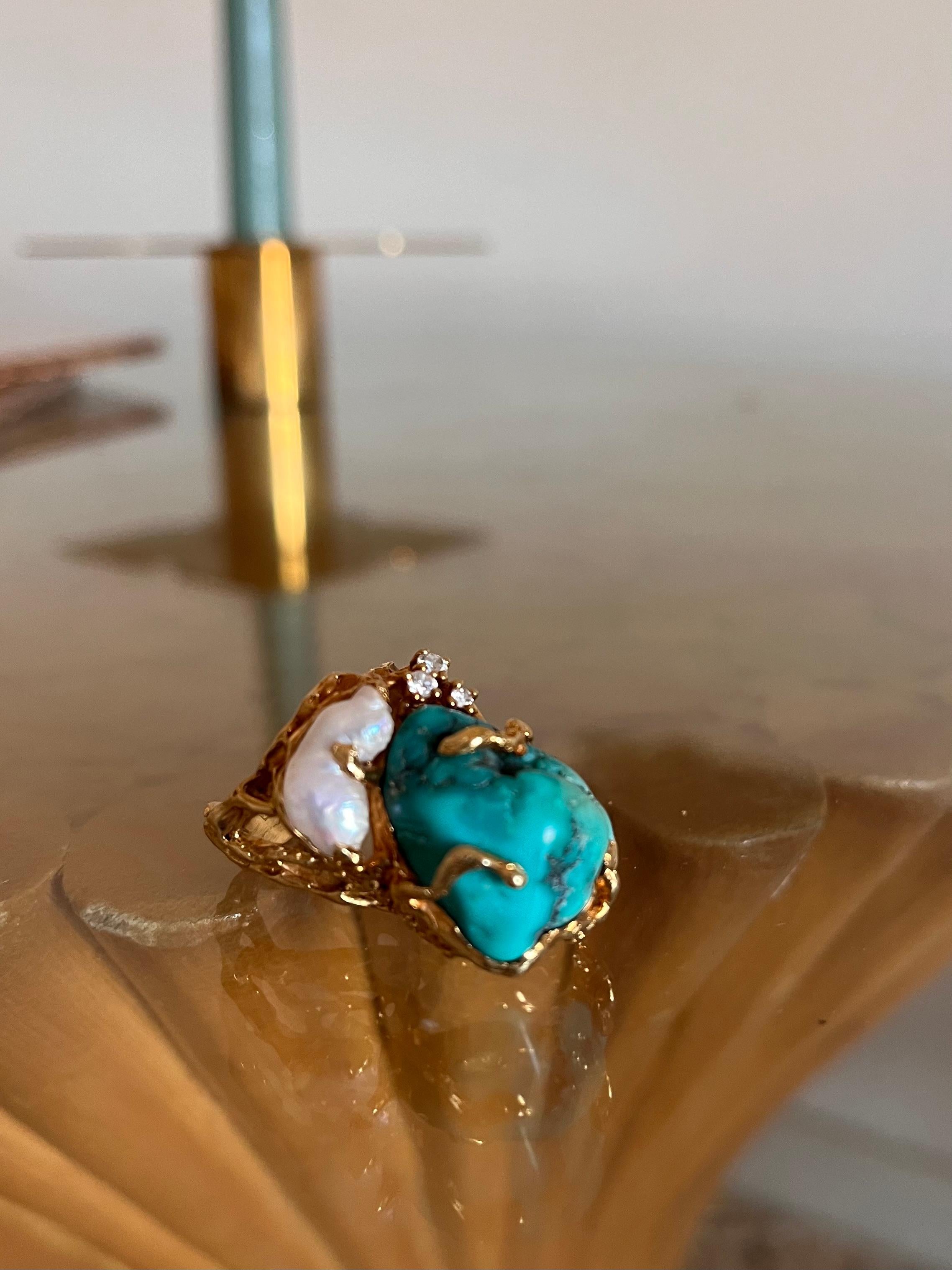 Spectacular Sculptural Ring made with a rough cut Turquoise cabochon, a baroque pearl and diamonds. Unique piece exhibited in Kremlin on the 80s

One of the most innovative jewelers of his time, Gilbert Albert was known for using unusual materials