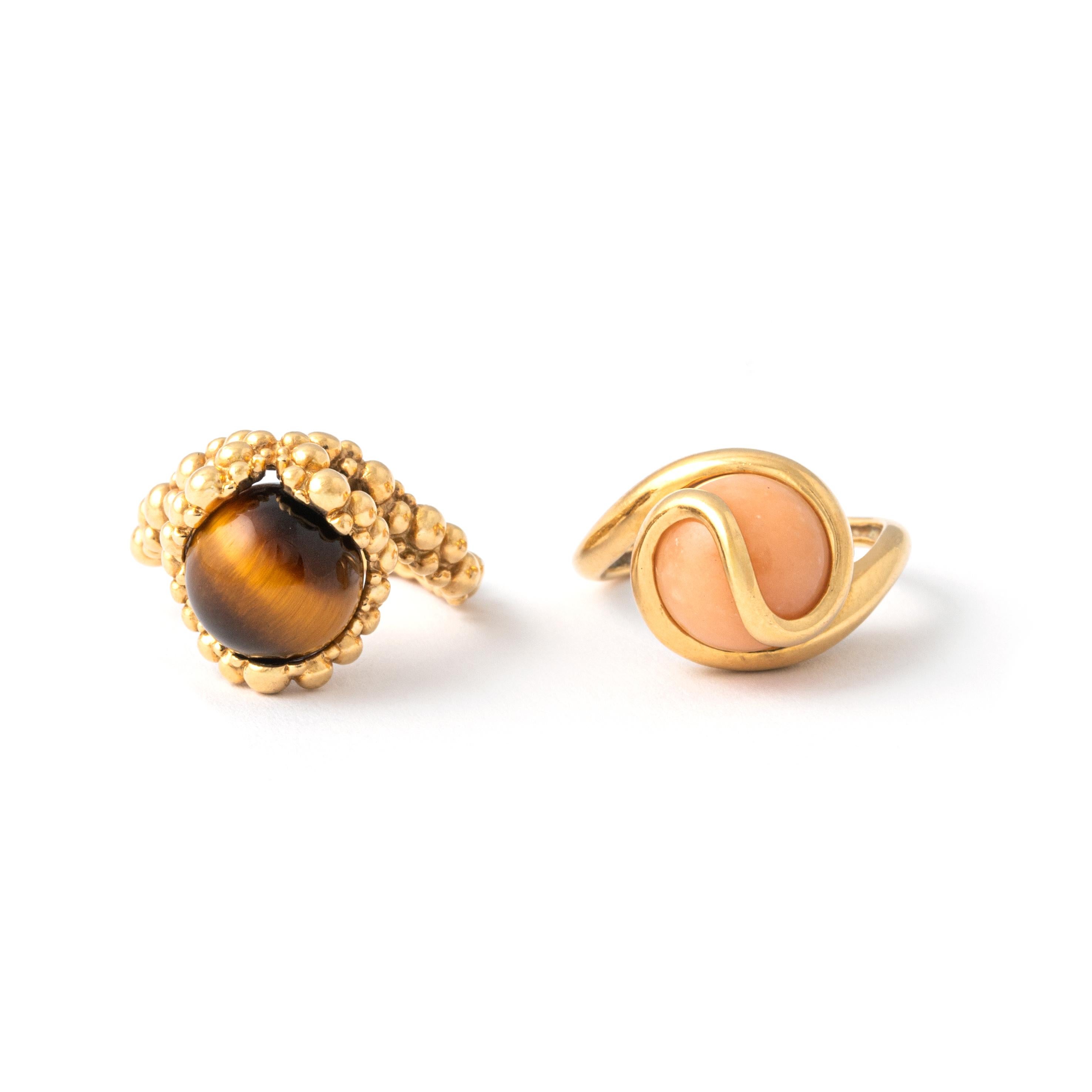 Two Rings in 18K Yellow Gold and two beads in hard stone including ne Tiger's Eye.

By Gilbert Albert.

Immerse yourself in the exquisite craftsmanship of Gilbert Albert with this unique set of Two Rings in 18K Yellow Gold adorned with two beads in