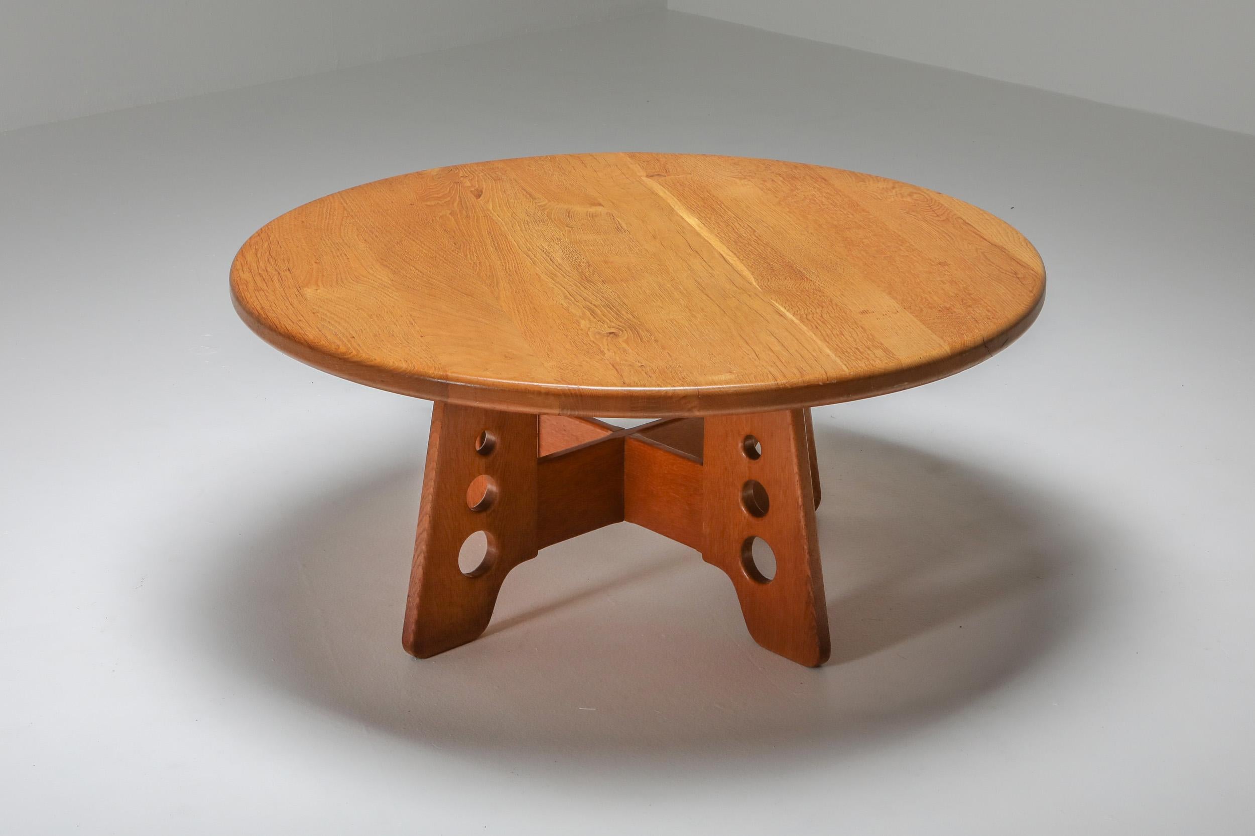 Oak coffee table, Mid-Century Modern, Gilbert Marklund for Furusnickarn AB, 1960s

Round topped coffee table in solid oak, trapezoid cross like base.
Naturalist wabi sabi feel. Would fit as well in an Axel Vervoordt inspired interior as in a more