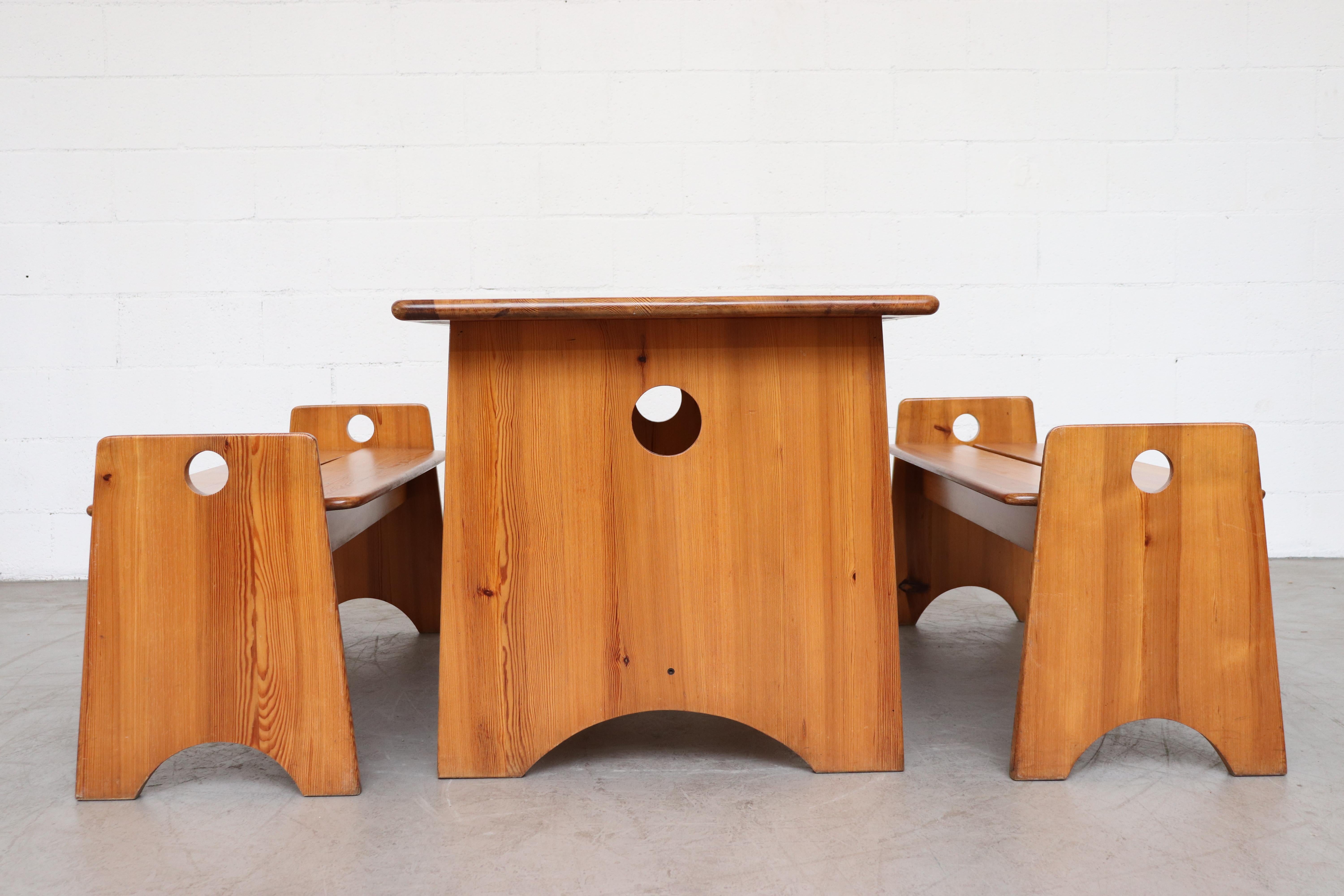 Lovely Gilbert Marklund pine dining table and 2 bench set. Organically carved and jointed. Set consists of one table and two benches. In good original condition with some signs of wear consistent with their age and use. Benches measure: 49 x 16.25 x