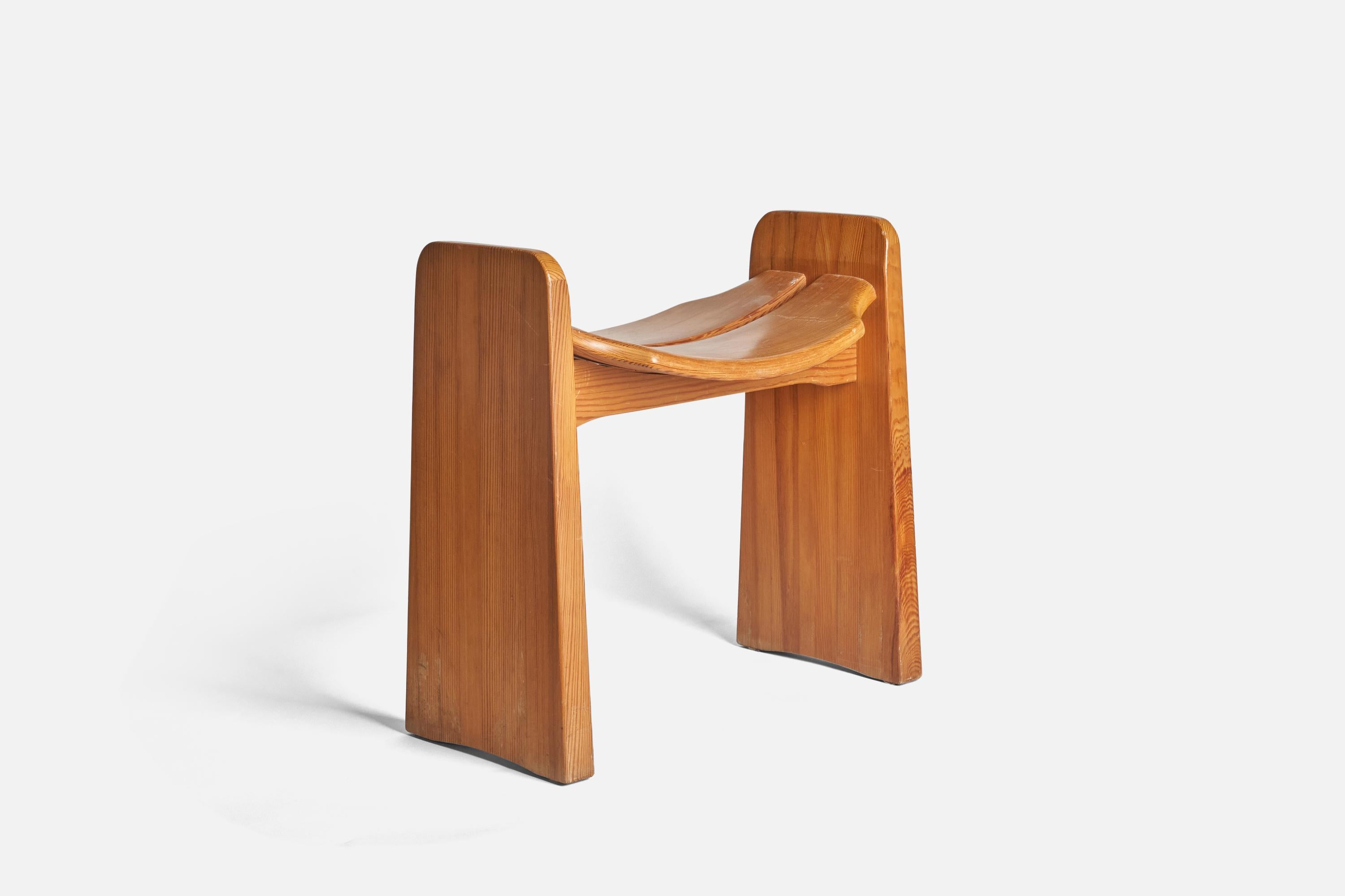 A pine stool designed by Gilbert Marklund and produced by his own firm 