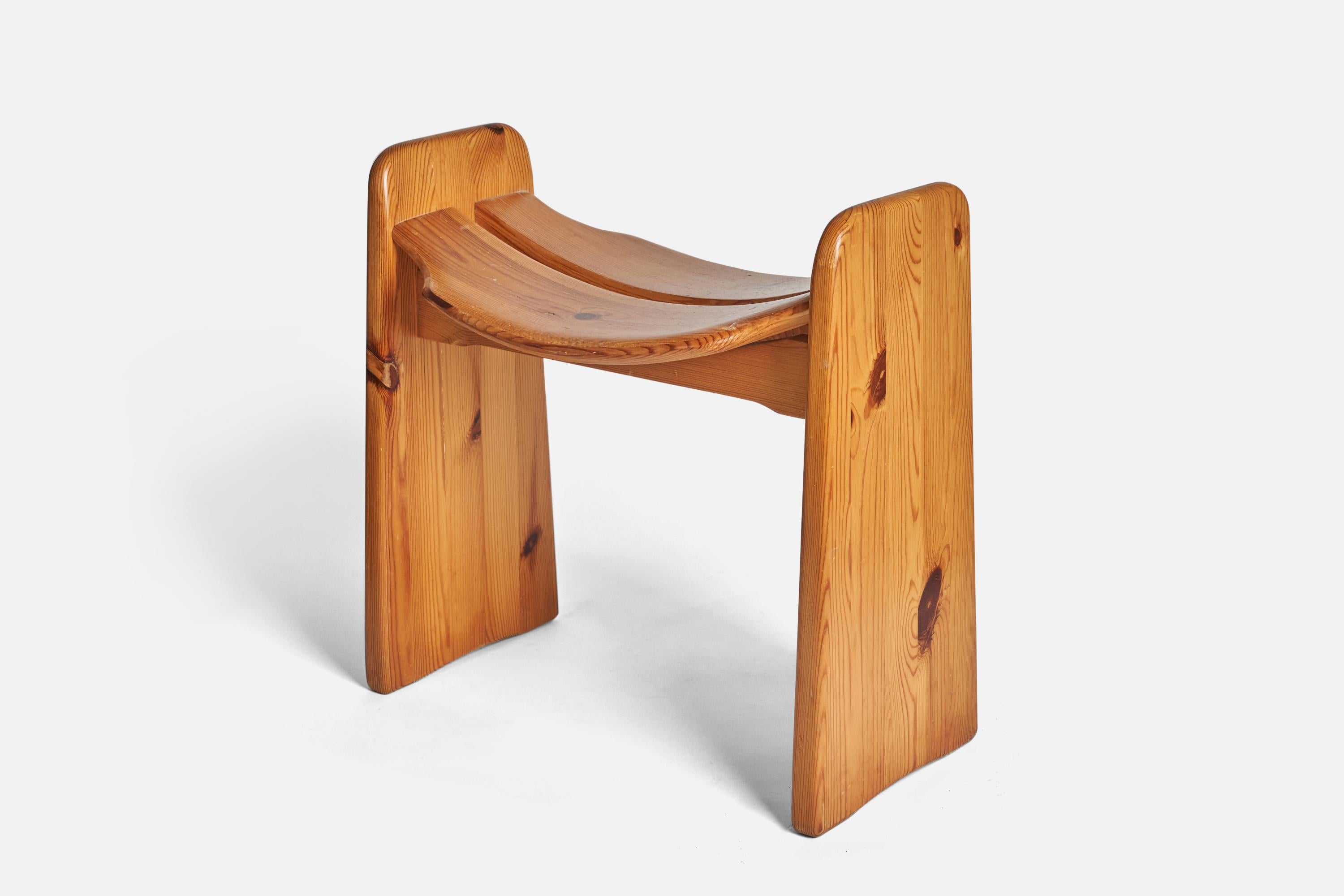 A solid pine stool designed by Gilbert Marklund and produced by his own firm 