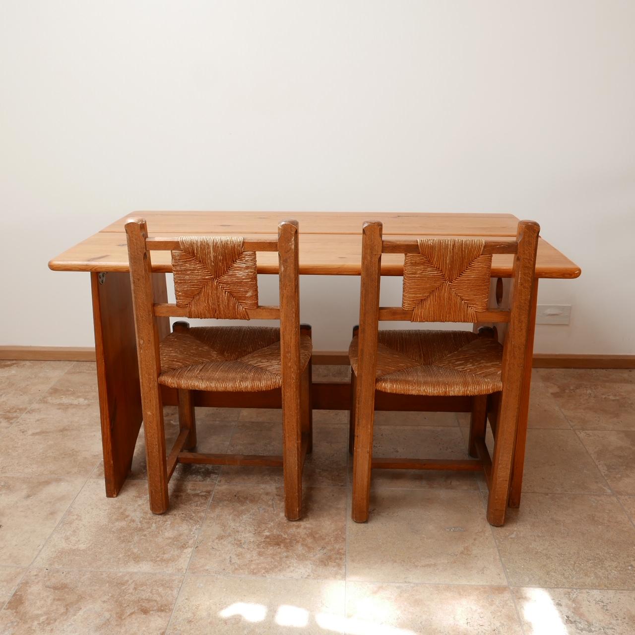 A dining table by Gilbert Marklund.

Pine, Sweden, circa 1970s.

Made for Furusnickarn AB.

Scarce and wildly stylish.

Dimensions: 140 W x 78 D x 72 H in cm.