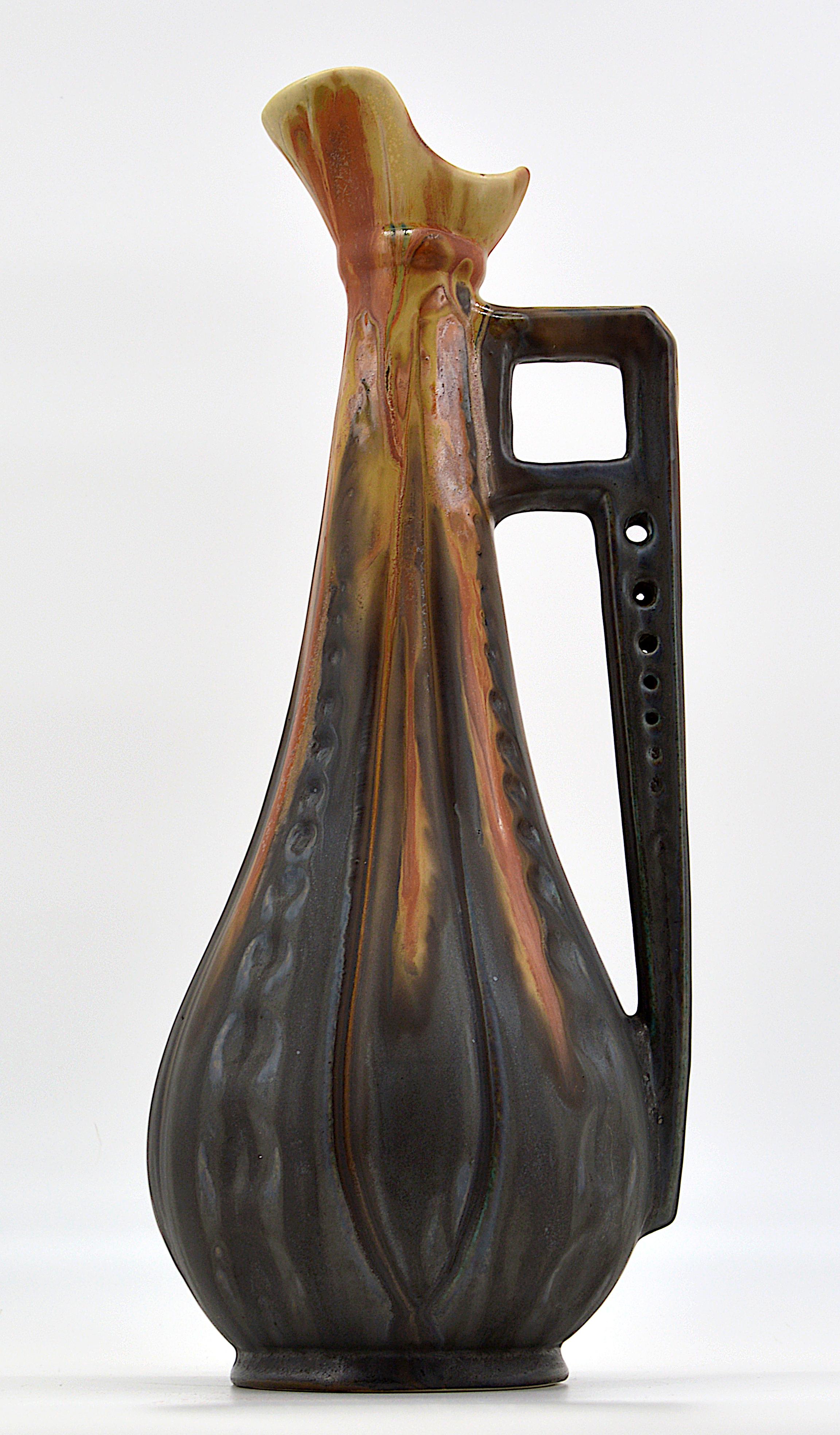 Tall French stoneware ewer by Gilbert Metenier (Gannat), France, 1910s. Tall and spectacular ewer. Great effect! Measures: Height 43.8 cm, 17.2 in., width 17.5 cm, 6.9 in., depth 16.5 cm, 6.5 in. Same period as Denbac, Alexandre Bigot, Léon Pointu,