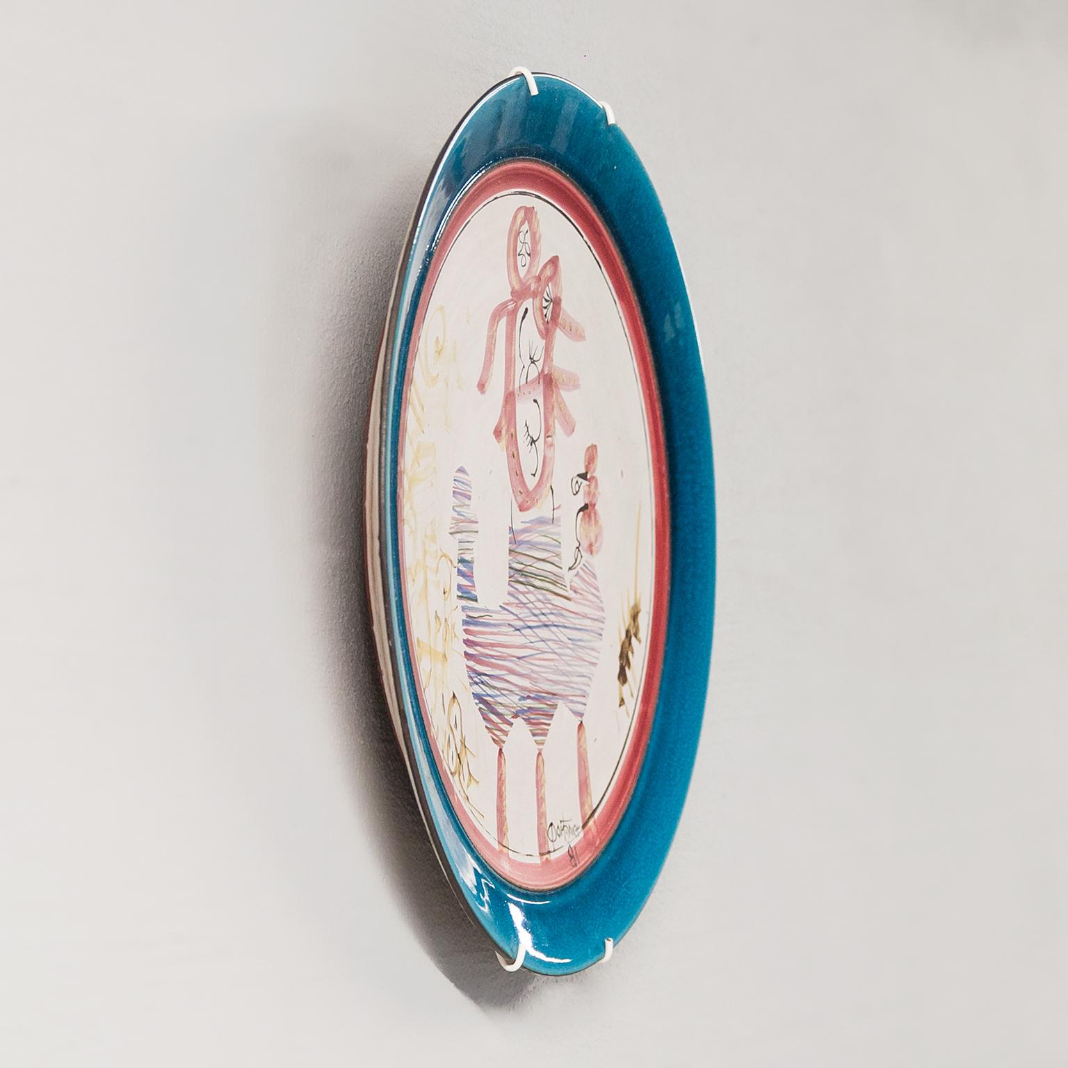 A rare Gilbert PORTANIER born in 1926 ceramic plate / bowl with a design of an abstract polychrome painted inspiration in the middle, bright blue surround and red rim. Unique piece. Monogrammed on with Portanier 1981.
