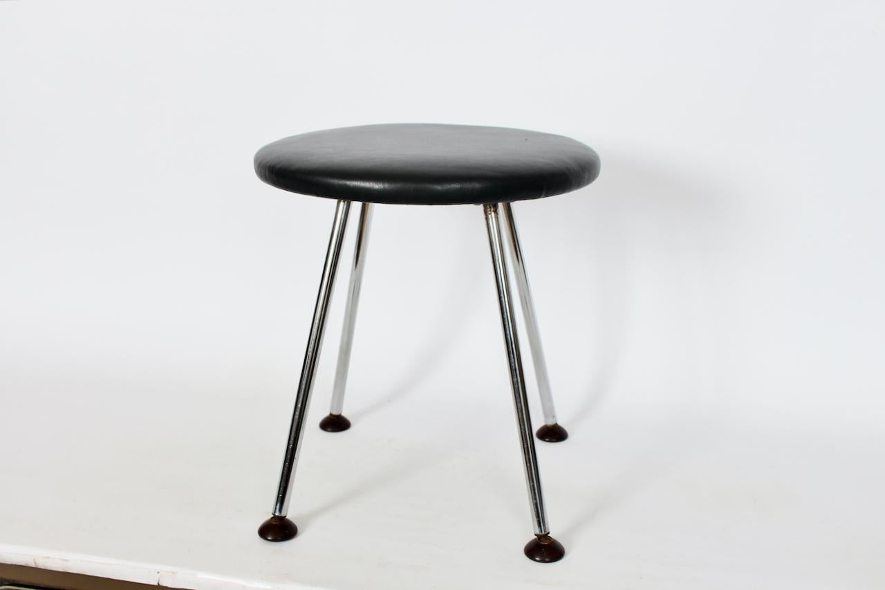 Gilbert Rohde attributed Chrome and Leather Flamingo Chrome Line Stool. Featuring a strong circular four legged Chrome framework, 12.5 W corner to corner leg measurements, new black leather 14W seat, glides rotate easily for surface adjustment.
