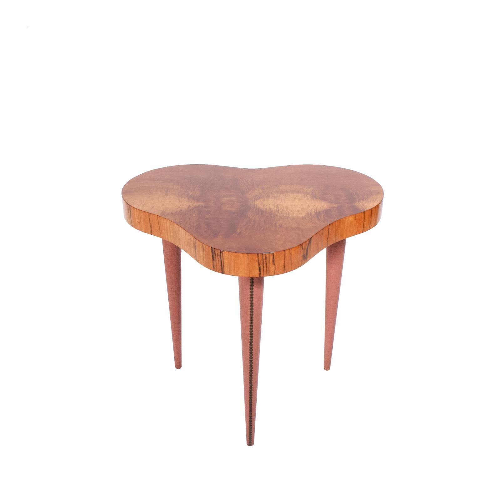Rare table design by Gilbert Rohde from great Paldao Group series legs covered with original oil cloth with nail trim. Woods are Paldao edge and Acacia burl top on free form top. Design number 4187 stamp.