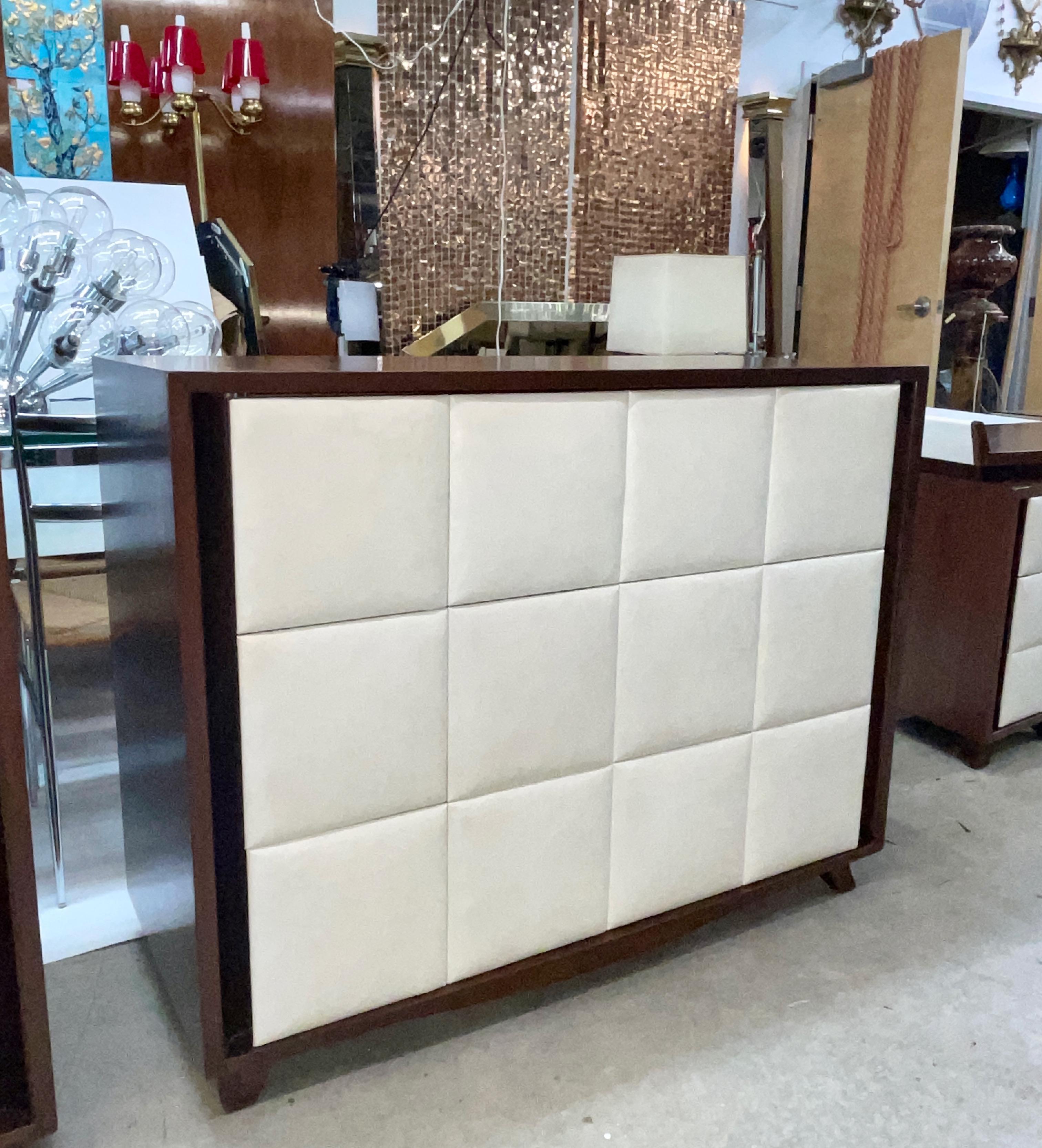 We have a total of three available of these beautifully refinished mahogany chests of three drawers by Gilbert Rohde for Herman Miller's 4140 collection with original off-white 