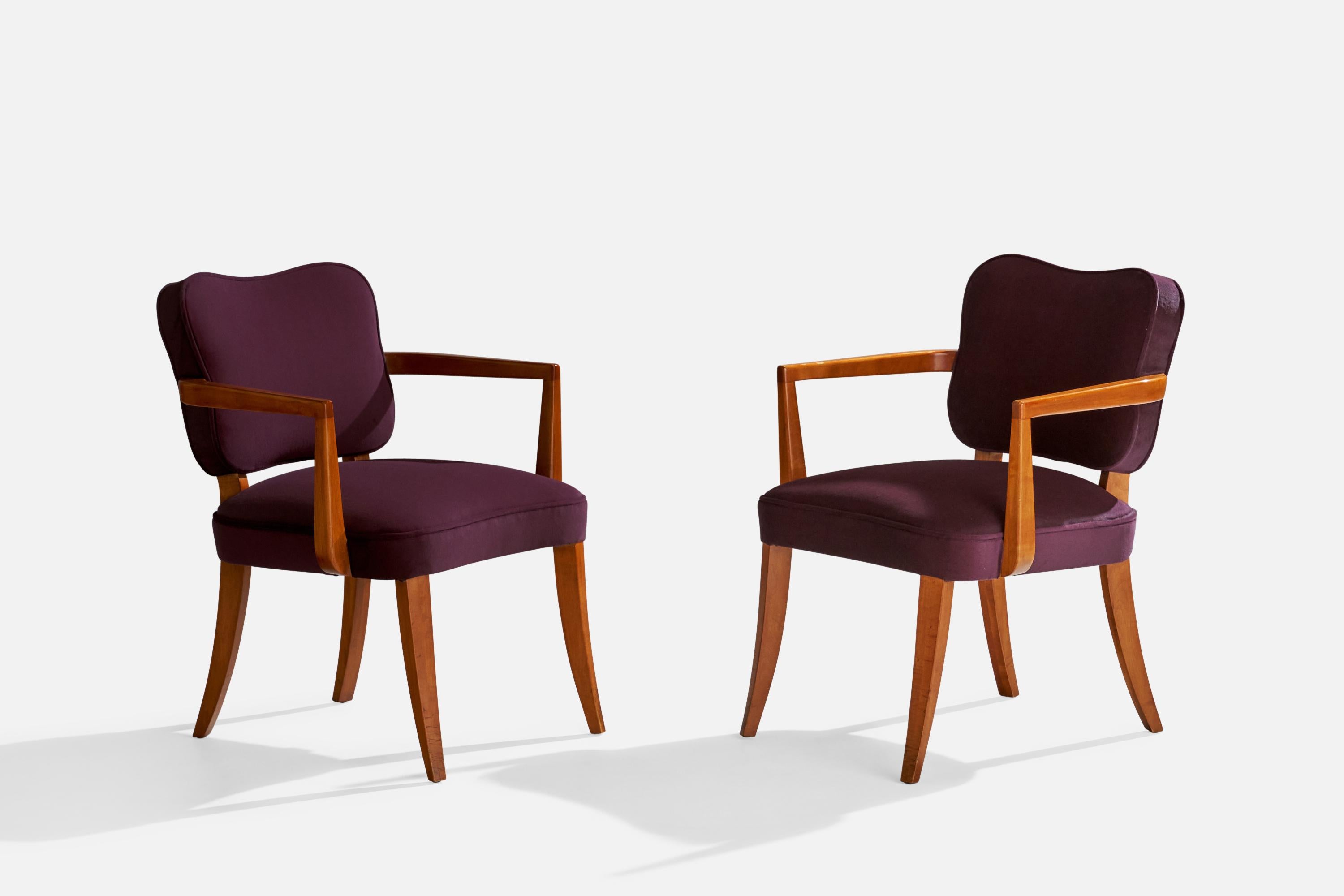 A pair of cherrywood and purple velvet armchairs designed by Gilbert Rohde and produced by Herman Miller, Zeeland, Michigan, 1940s. 

Seat height 17.5”.